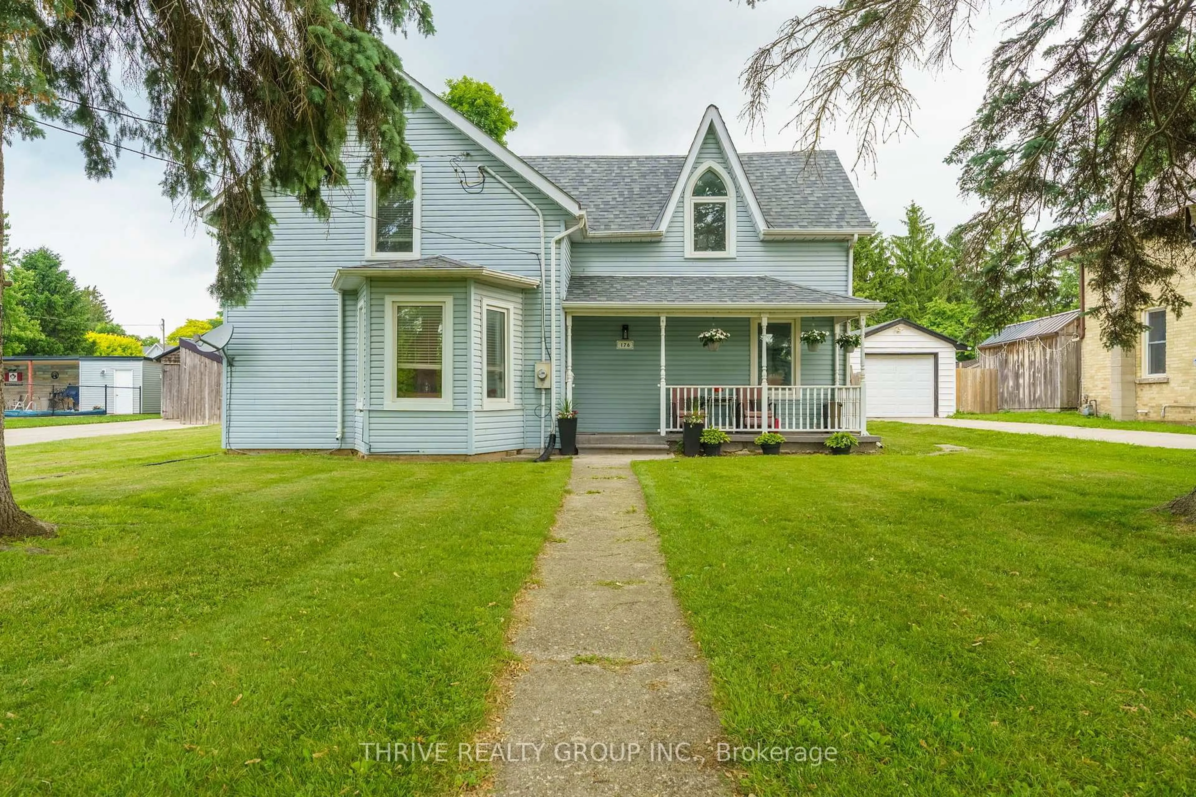 A pic from outside/outdoor area/front of a property/back of a property/a pic from drone, street for 176 Mill St, North Middlesex Ontario N0M 2K0