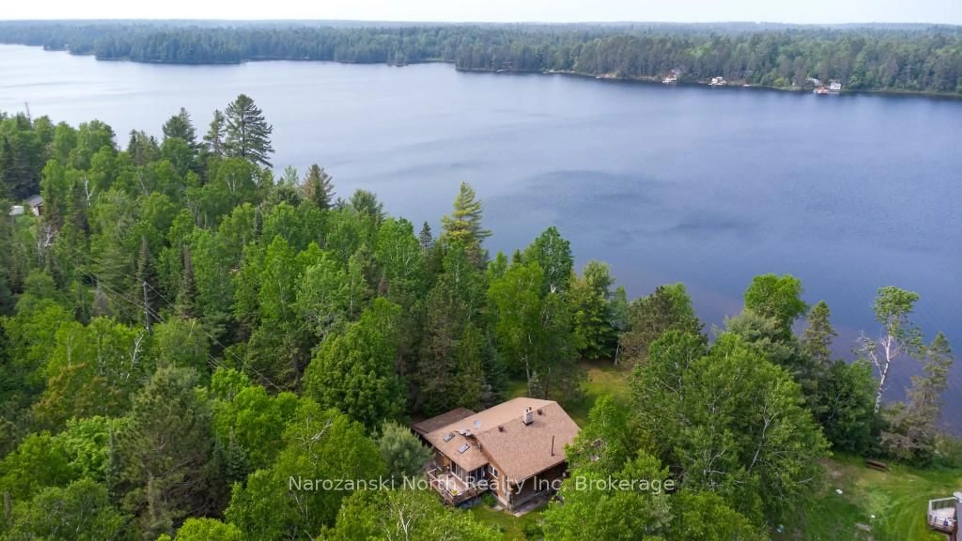 A pic from outside/outdoor area/front of a property/back of a property/a pic from drone, water/lake/river/ocean view for 1379 B Owl's Nest Rd, French River Ontario P0M 1A0