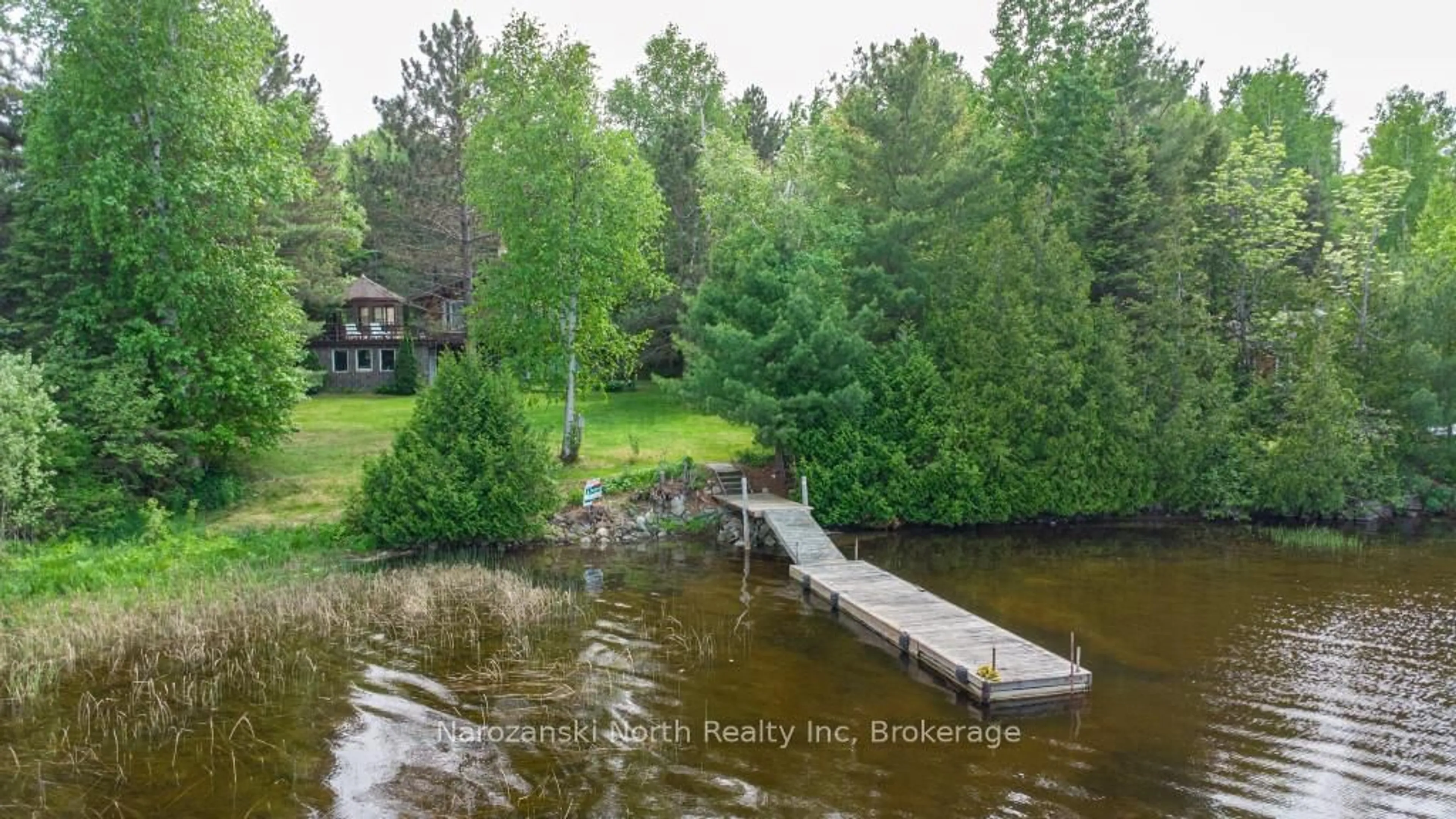 A pic from outside/outdoor area/front of a property/back of a property/a pic from drone, water/lake/river/ocean view for 1379 B Owl's Nest Rd, French River Ontario P0M 1A0