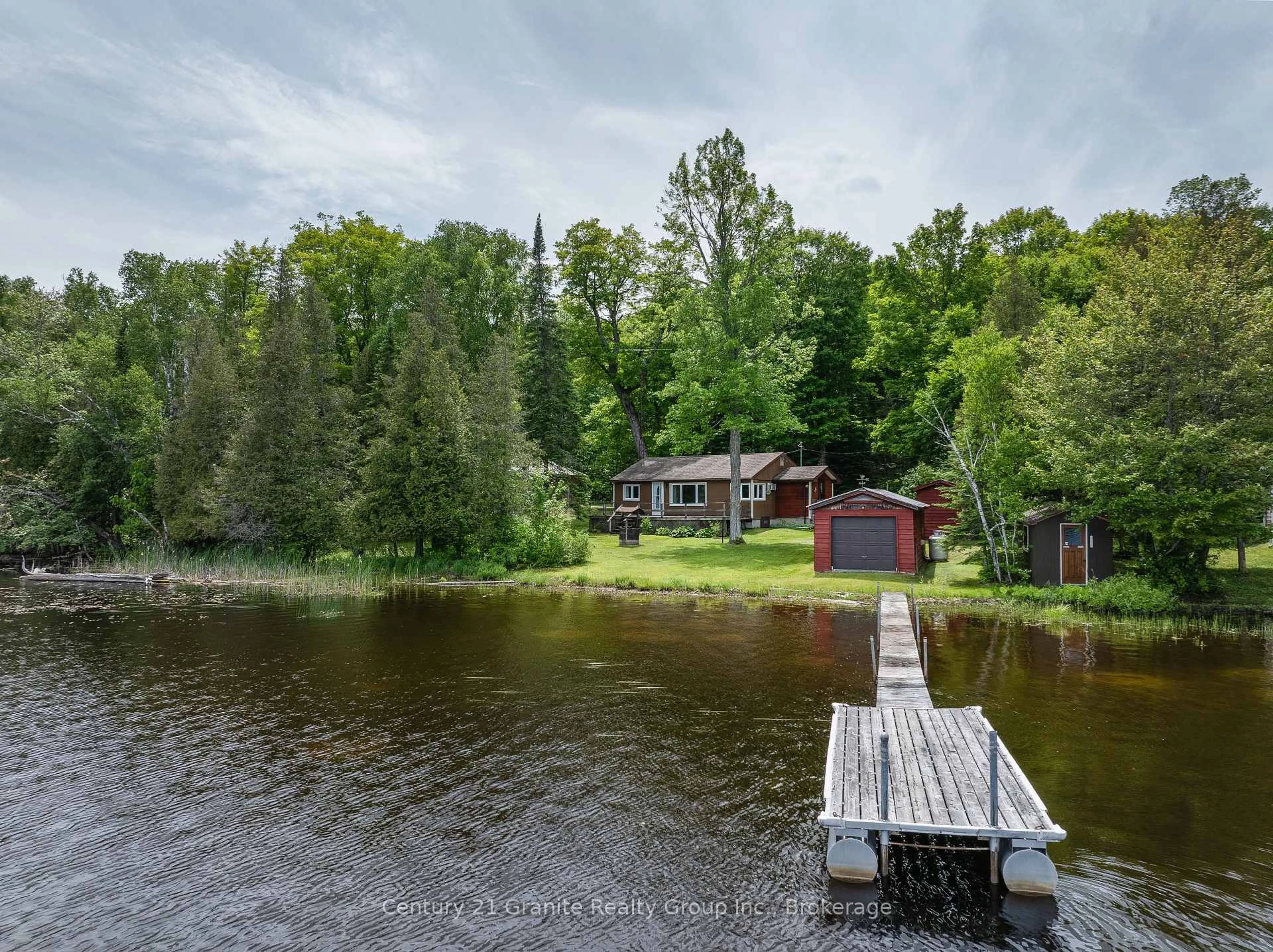 A pic from outside/outdoor area/front of a property/back of a property/a pic from drone, water/lake/river/ocean view for 1137 Sullivan Dr, Dysart et al Ontario K0M 1S0