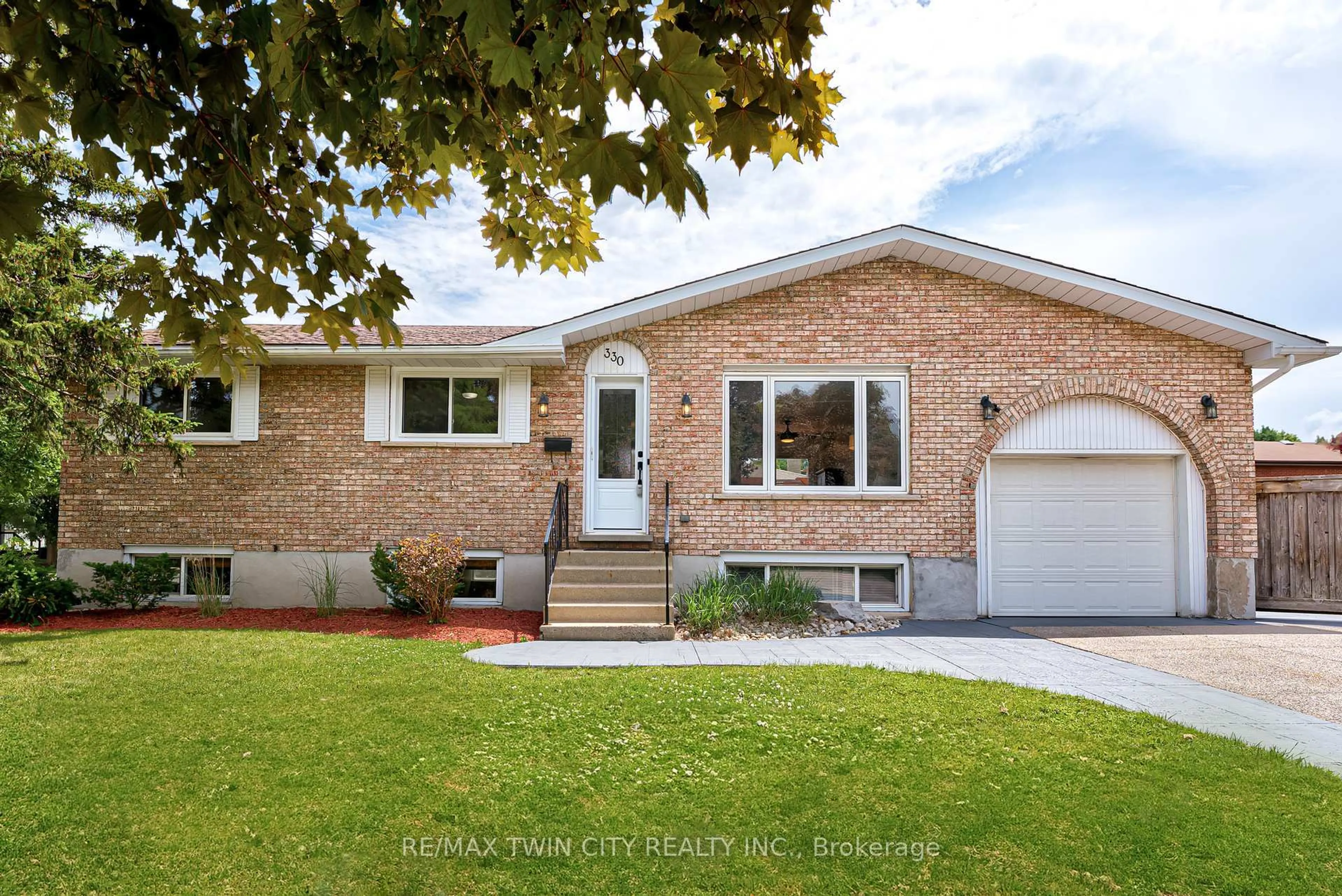 Home with brick exterior material, street for 330 Martindale Cres, Waterloo Ontario N2L 4X8