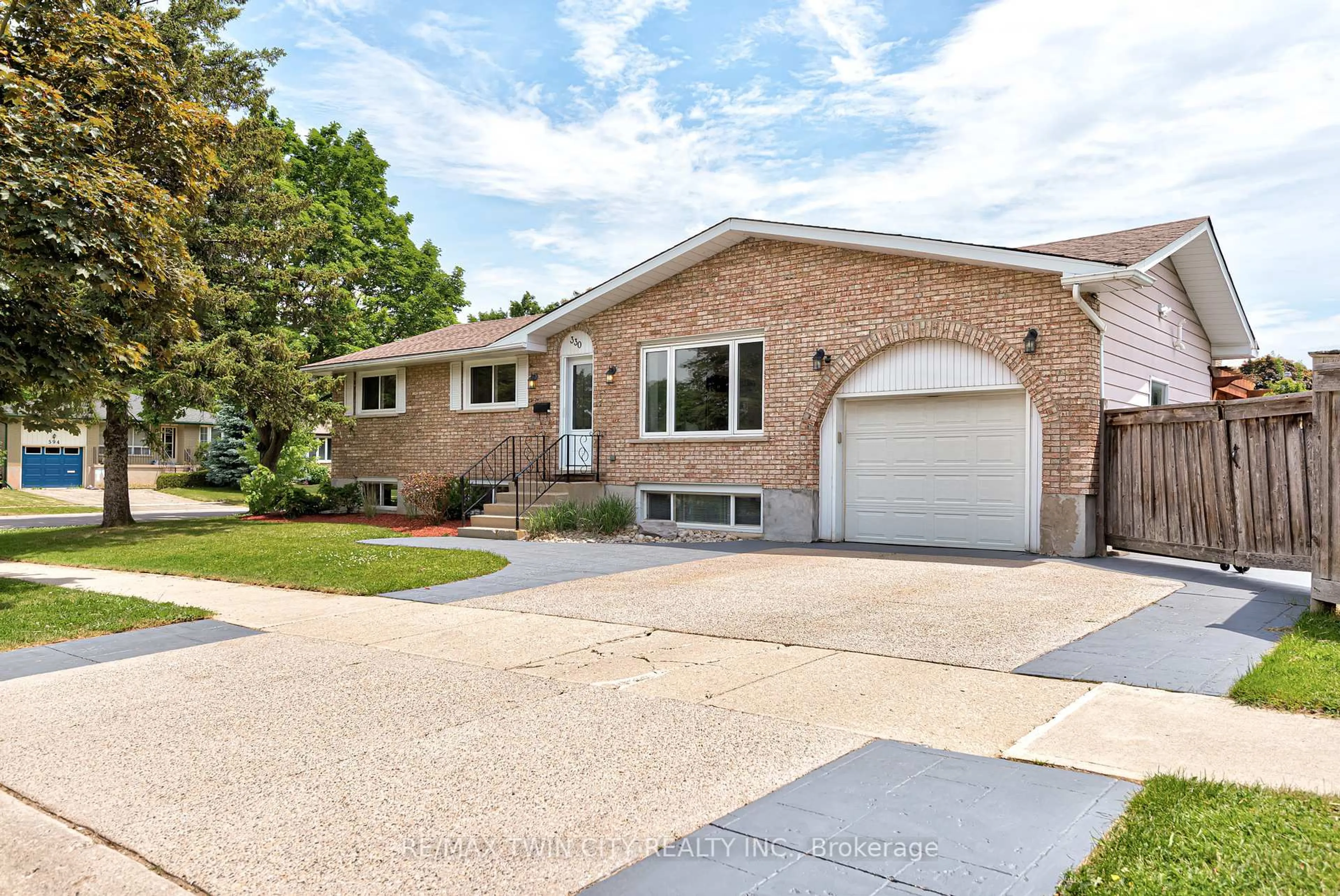 Home with brick exterior material, street for 330 Martindale Cres, Waterloo Ontario N2L 4X8