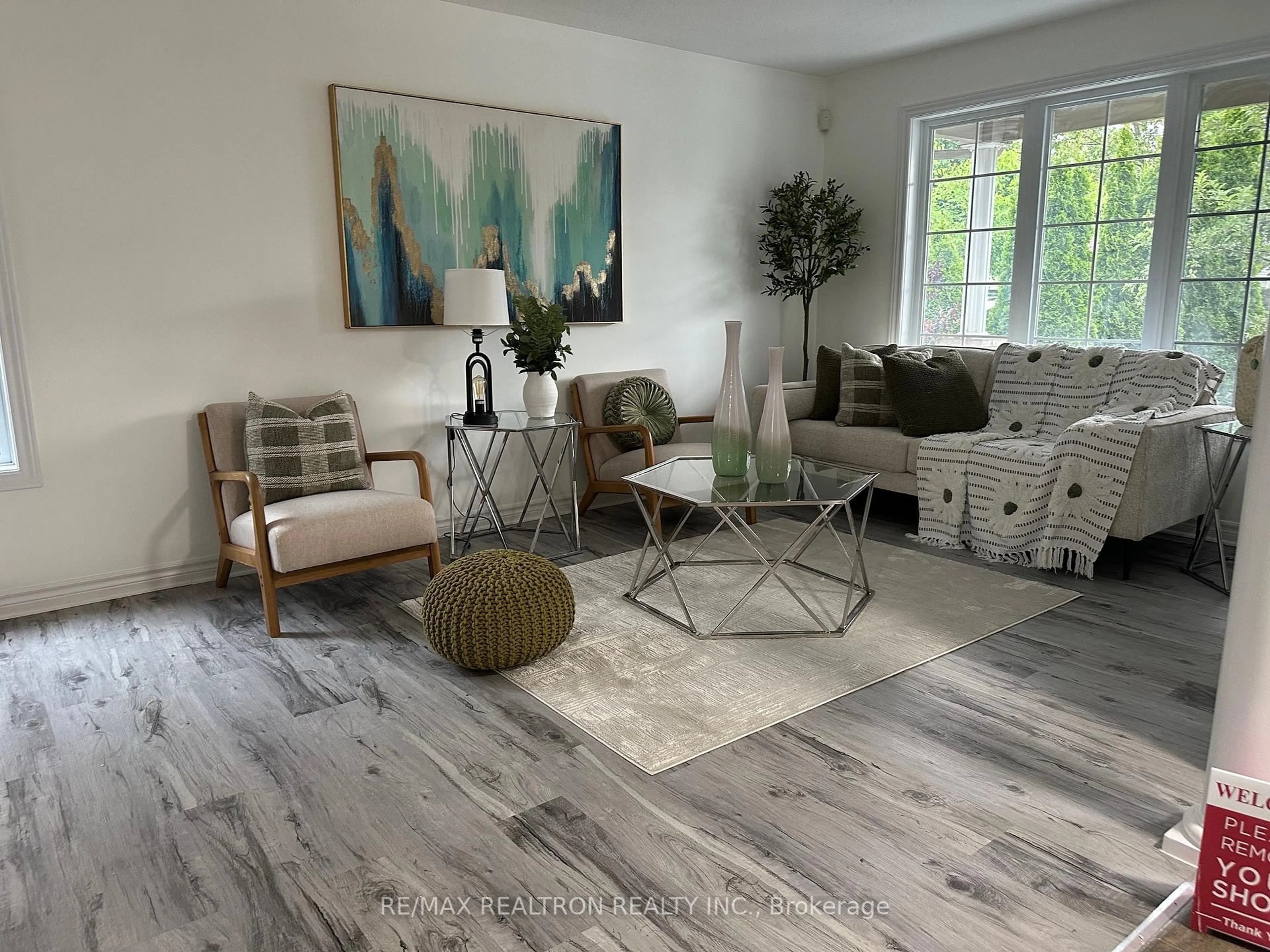 Living room with furniture, wood/laminate floor for 423 McMahen St, London East Ontario N5Y 0A2