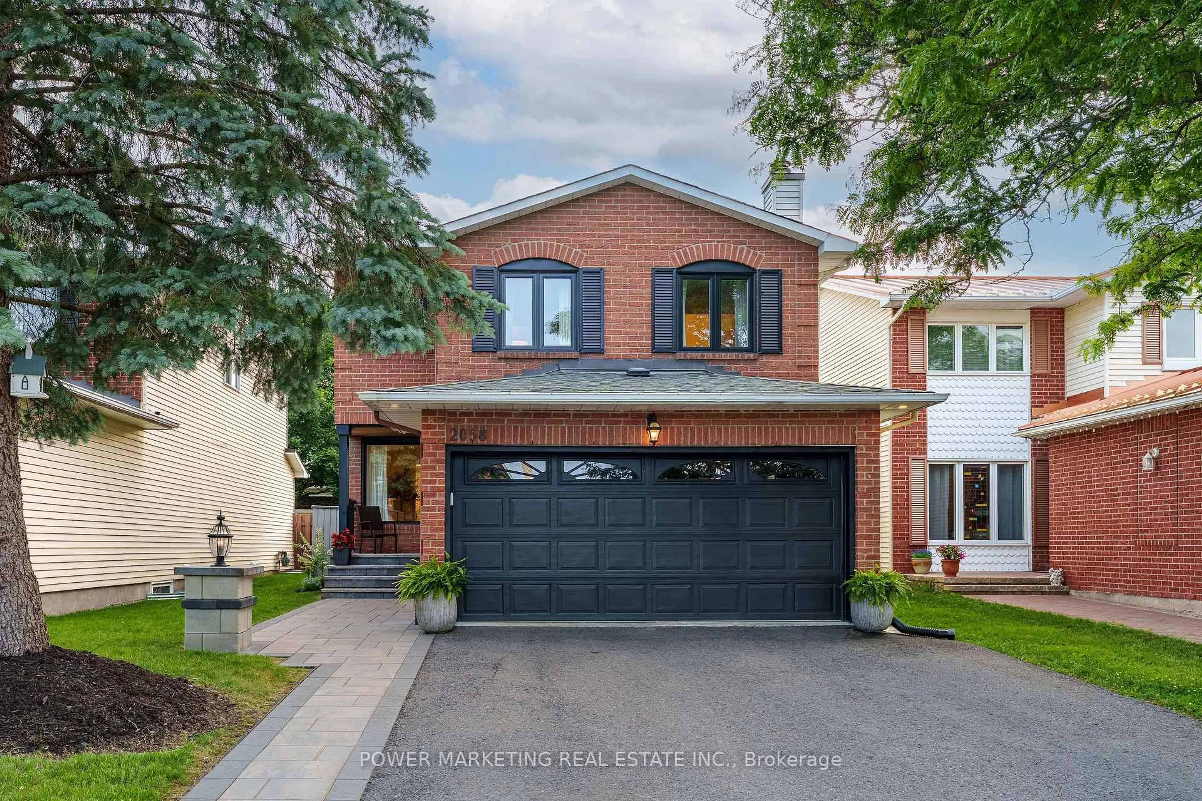 Home with brick exterior material, street for 2058 Wildflower Dr, Orleans Ontario K1E 3R3