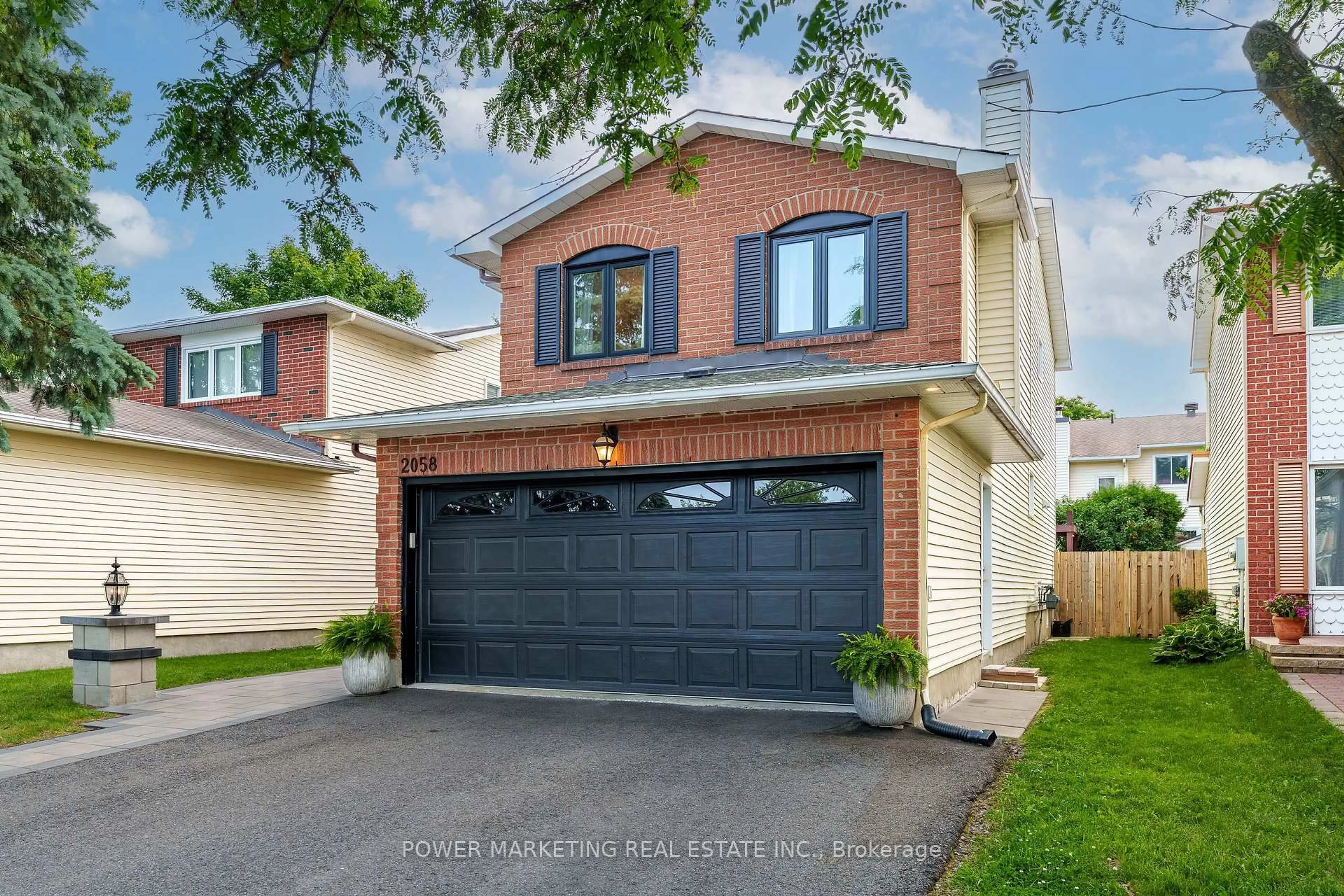 Home with brick exterior material, street for 2058 Wildflower Dr, Orleans Ontario K1E 3R3