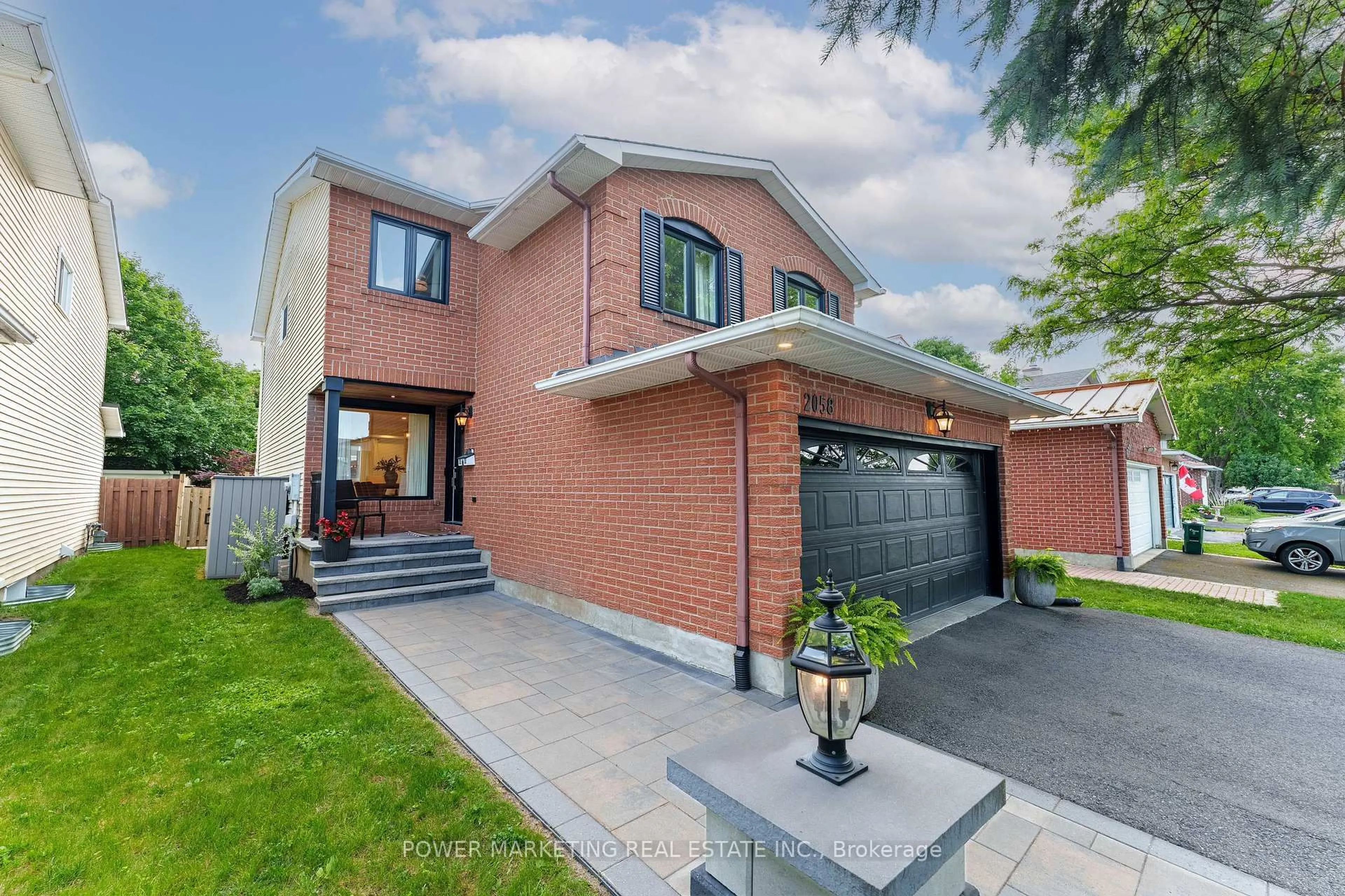 Home with brick exterior material, street for 2058 Wildflower Dr, Orleans Ontario K1E 3R3
