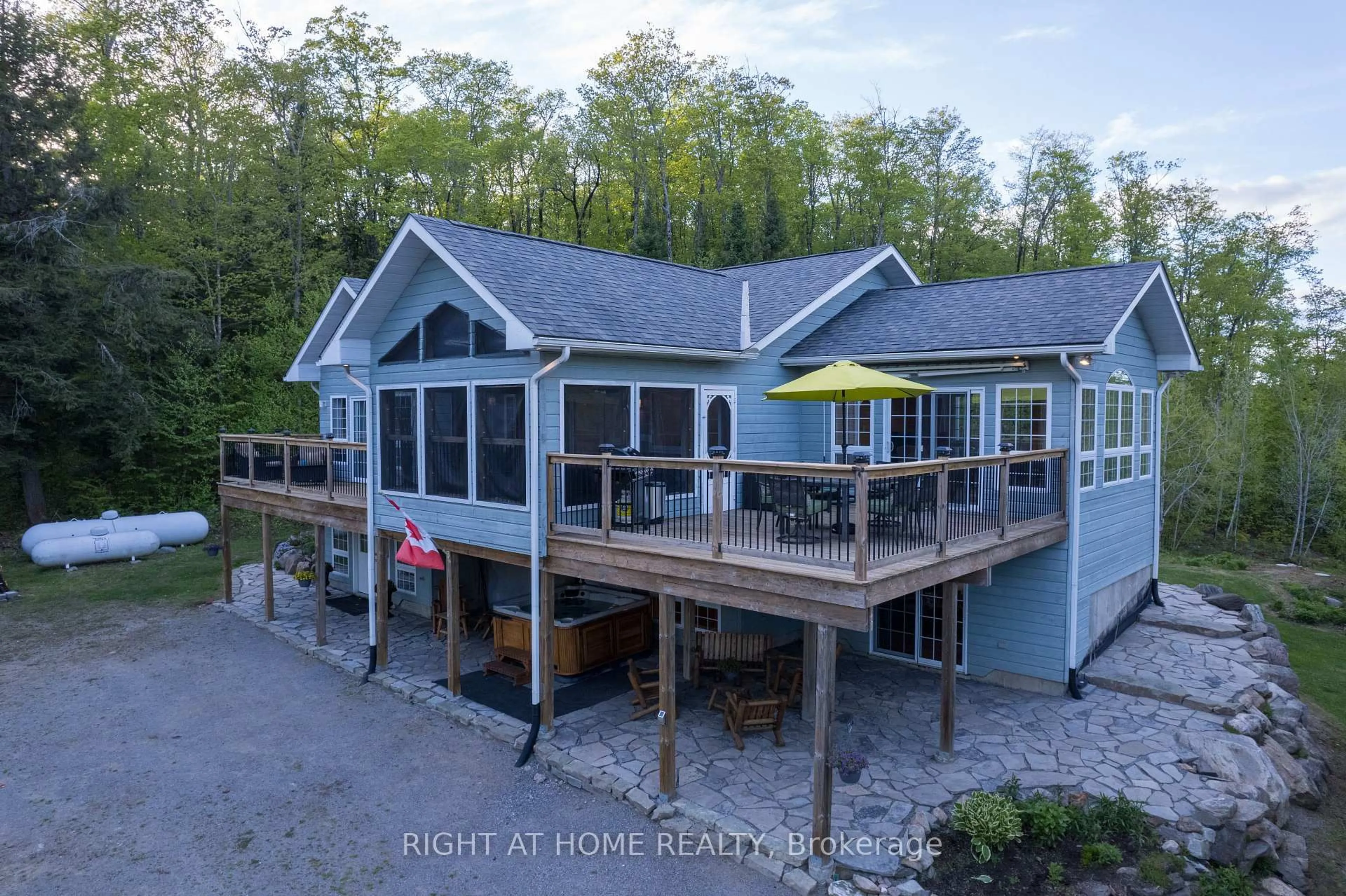 A pic from outside/outdoor area/front of a property/back of a property/a pic from drone, water/lake/river/ocean view for 1181 Grace River Rd, Dysart et al Ontario K0L 3C0
