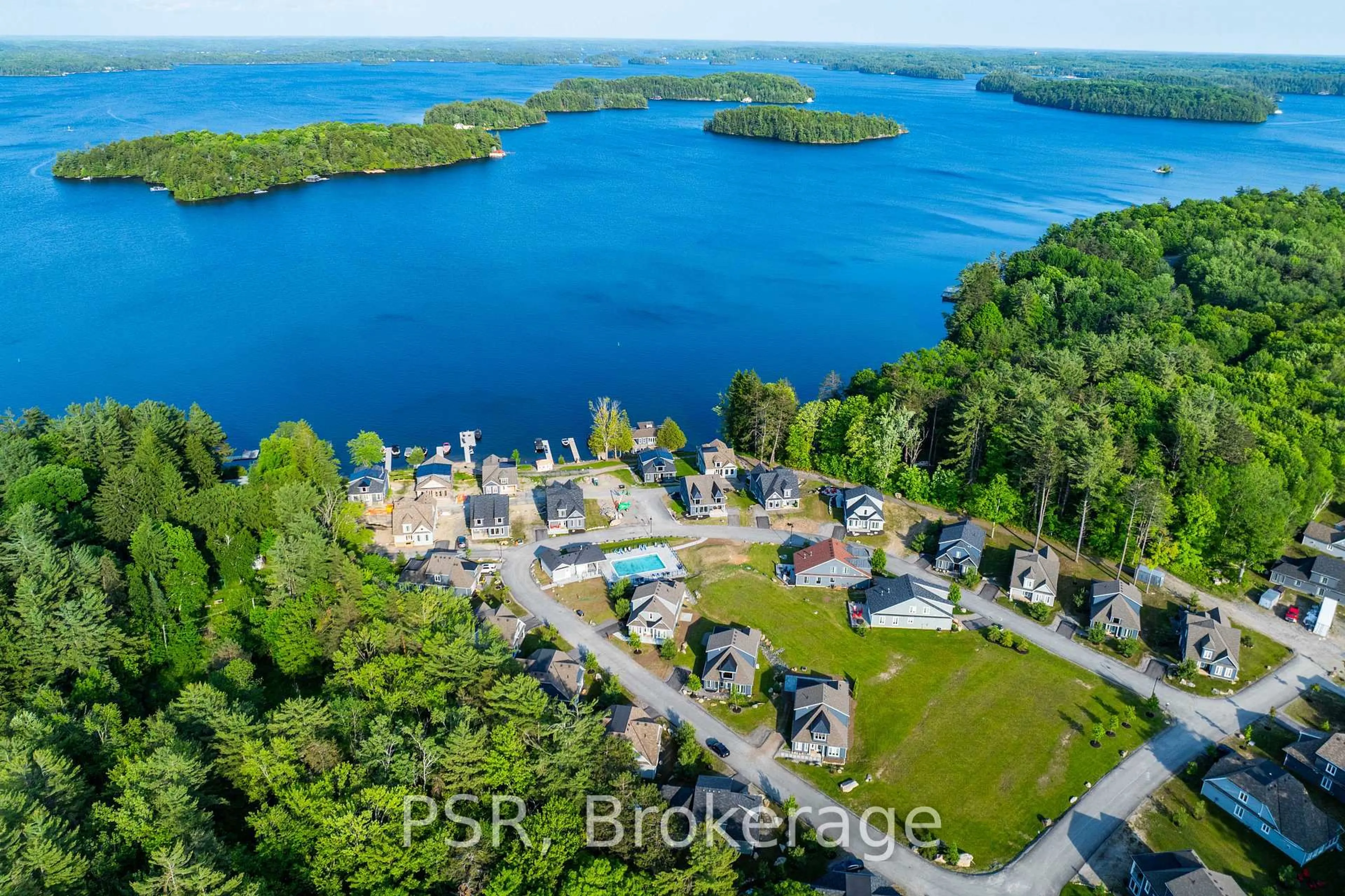 A pic from outside/outdoor area/front of a property/back of a property/a pic from drone, water/lake/river/ocean view for 2054 Peninsula Rd #15, Muskoka Lakes Ontario P0B 1G0