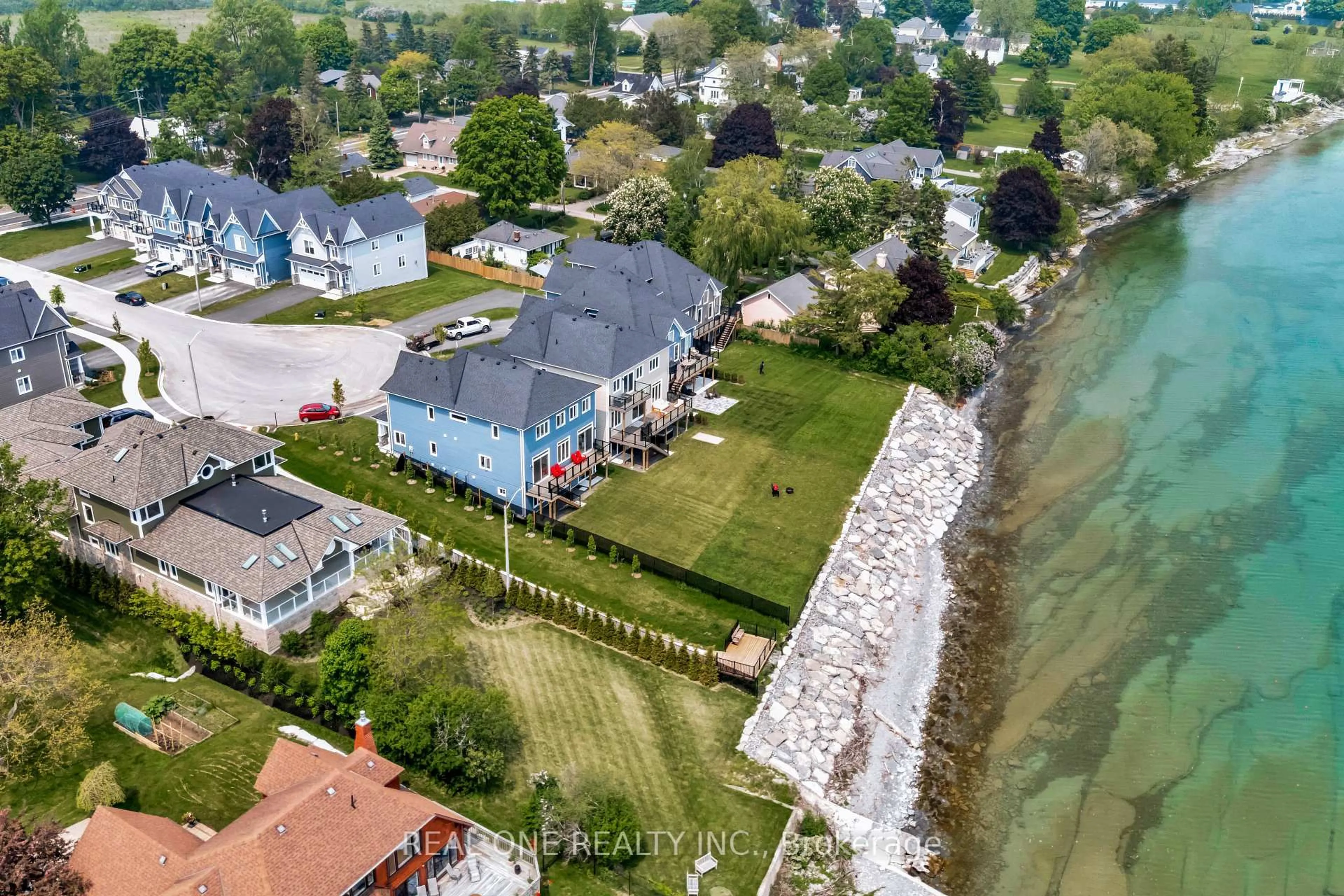 A pic from outside/outdoor area/front of a property/back of a property/a pic from drone, water/lake/river/ocean view for 14 Twelve Trees Crt, Prince Edward County Ontario K0K 3L0