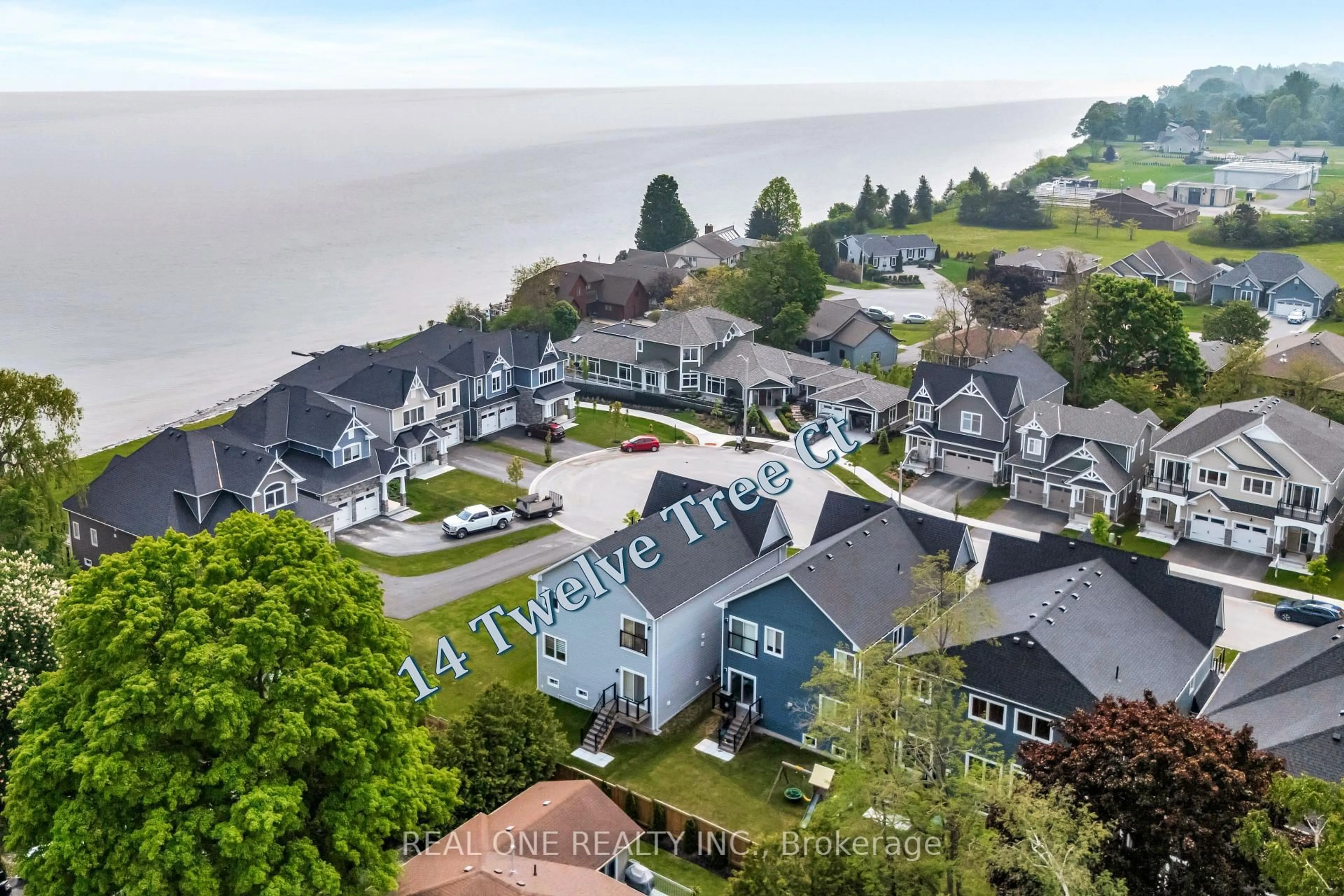 A pic from outside/outdoor area/front of a property/back of a property/a pic from drone, water/lake/river/ocean view for 14 Twelve Trees Crt, Prince Edward County Ontario K0K 3L0