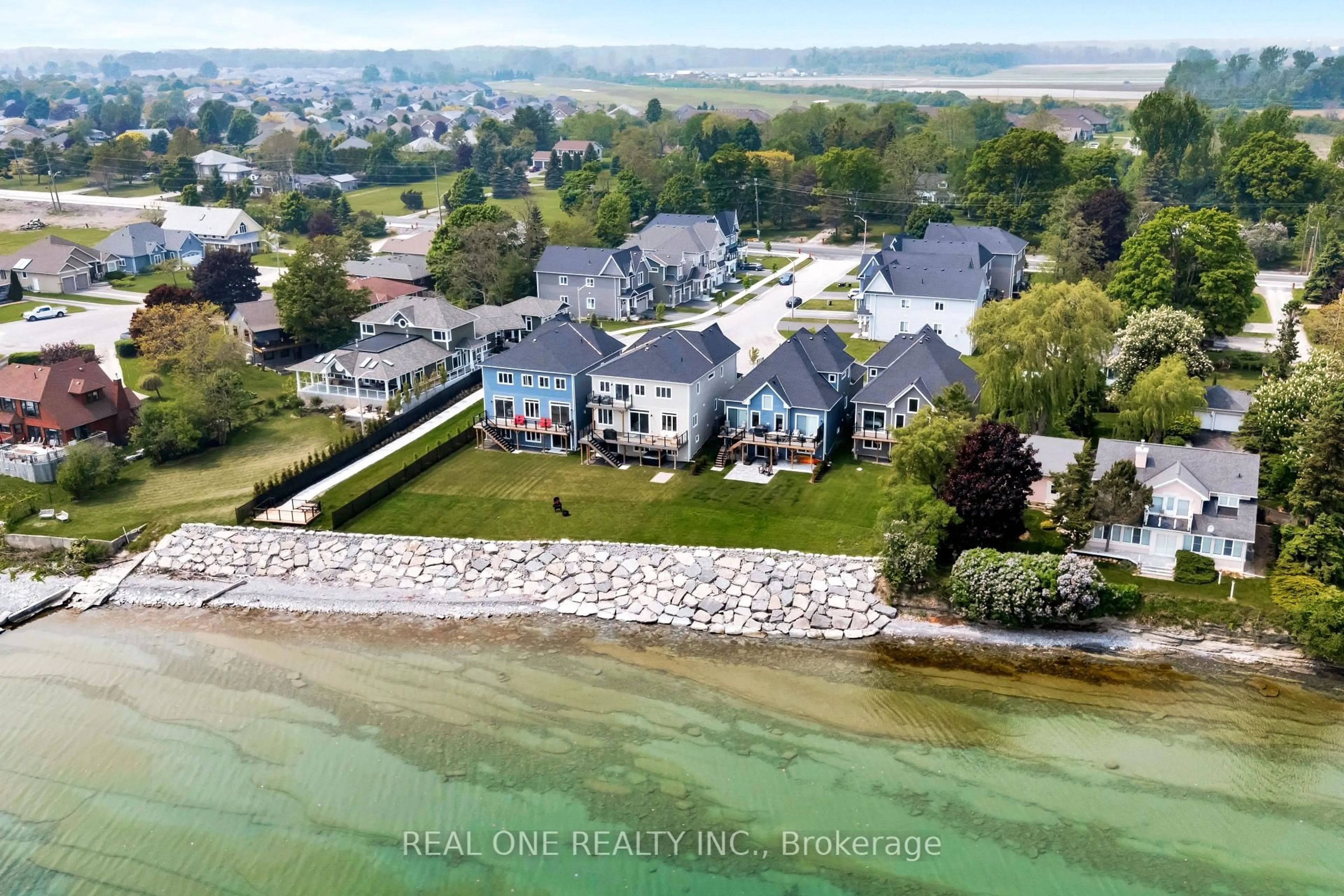 A pic from outside/outdoor area/front of a property/back of a property/a pic from drone, water/lake/river/ocean view for 14 Twelve Trees Crt, Prince Edward County Ontario K0K 3L0