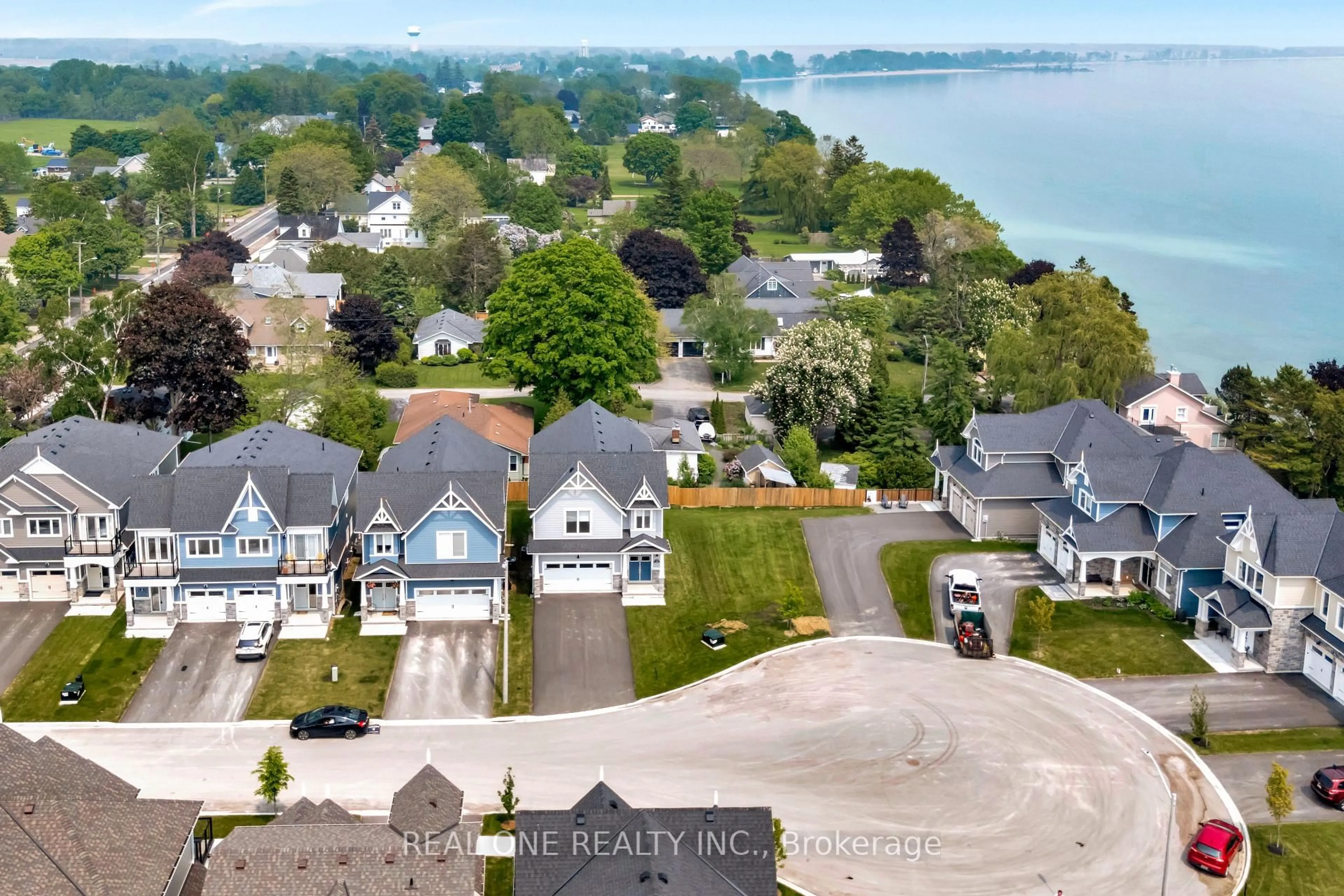 A pic from outside/outdoor area/front of a property/back of a property/a pic from drone, water/lake/river/ocean view for 14 Twelve Trees Crt, Prince Edward County Ontario K0K 3L0