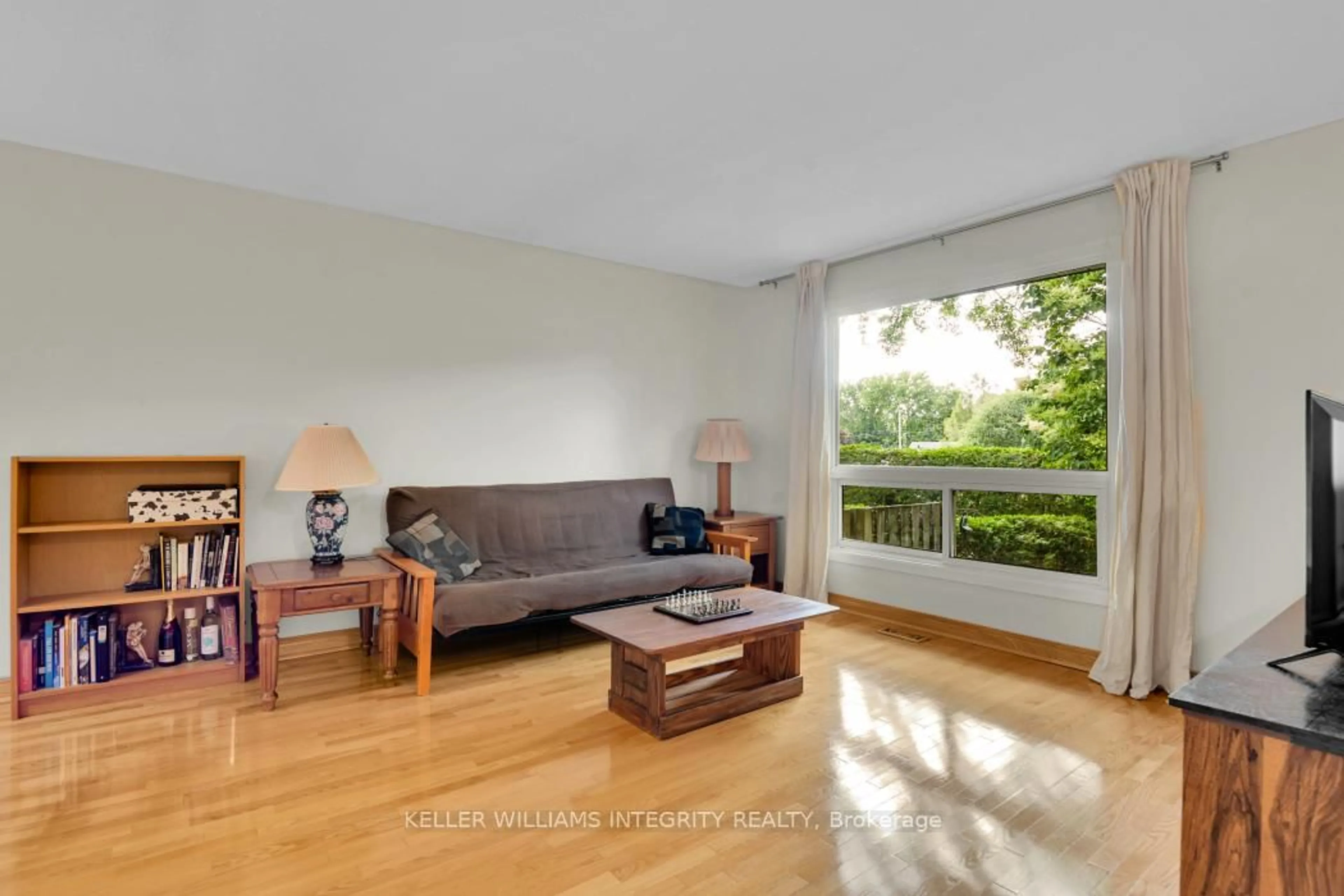 Living room with furniture, wood/laminate floor for 403 Montfort St #12, Ottawa Ontario K1L 8G8