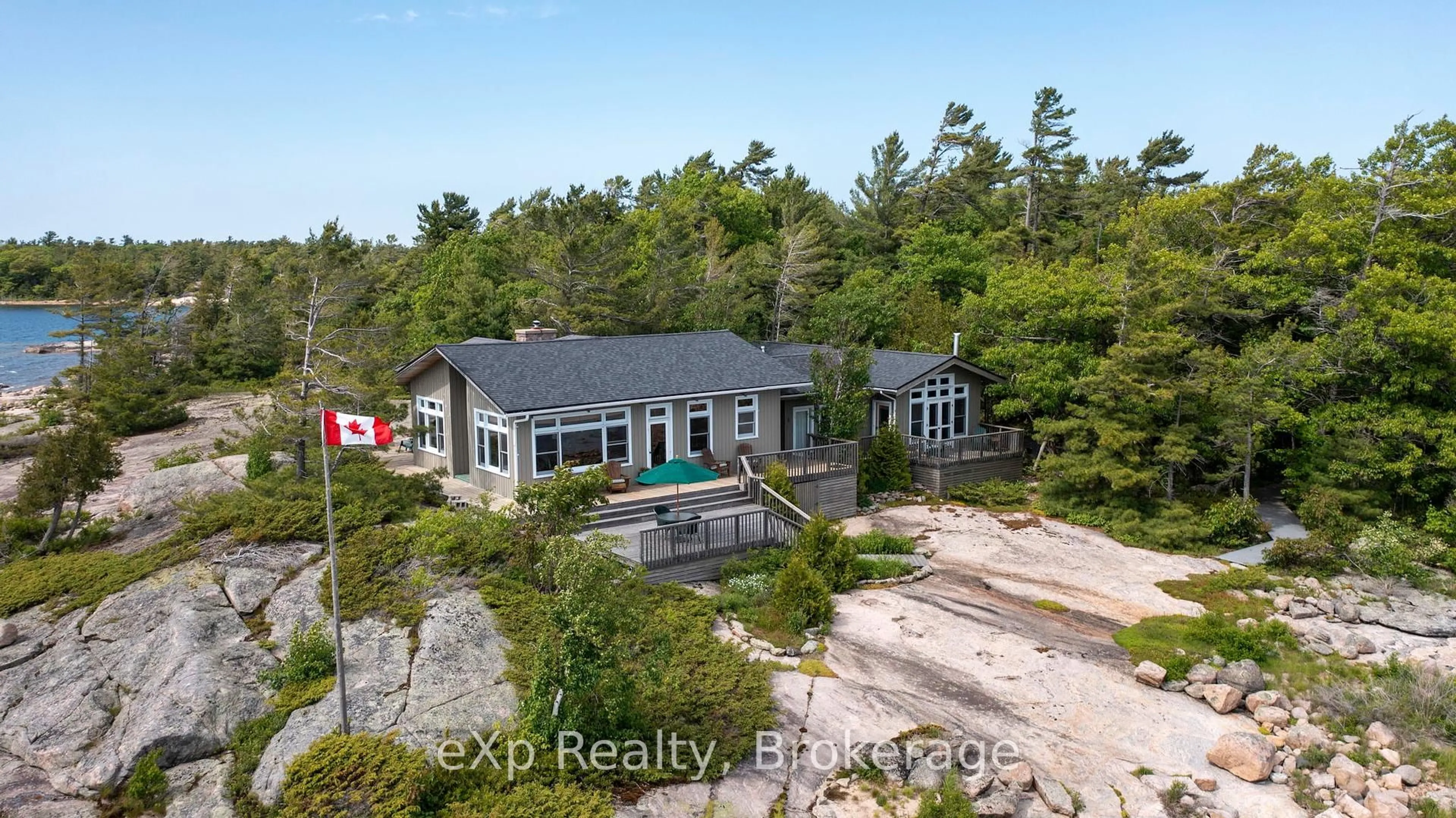A pic from outside/outdoor area/front of a property/back of a property/a pic from drone, water/lake/river/ocean view for 1 Nebahwin Island, Carling Ontario P0G 1G0