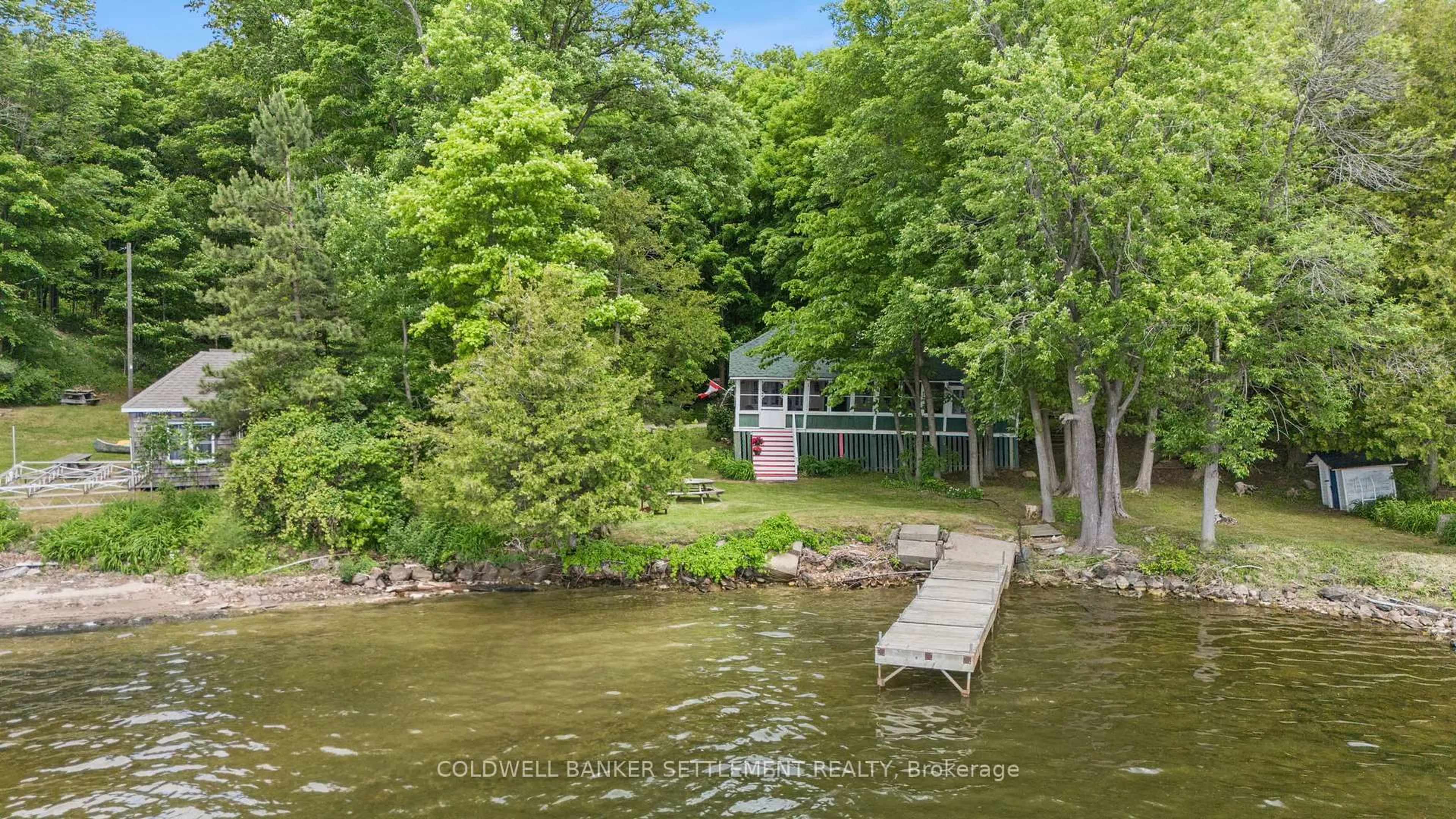 A pic from outside/outdoor area/front of a property/back of a property/a pic from drone, water/lake/river/ocean view for 771 Christie Lake 32D Lane, Perth Ontario K7H 3C6