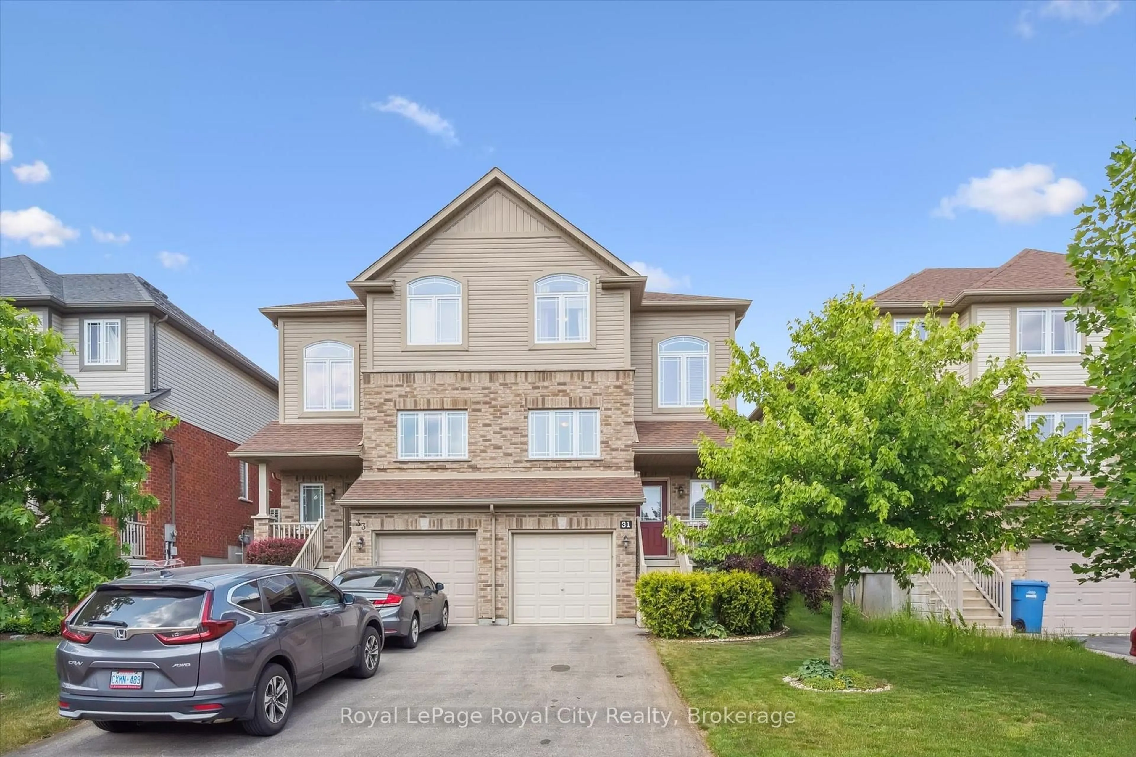 A pic from outside/outdoor area/front of a property/back of a property/a pic from drone, street for 31 Oakes Cres, Guelph Ontario N1E 0J6