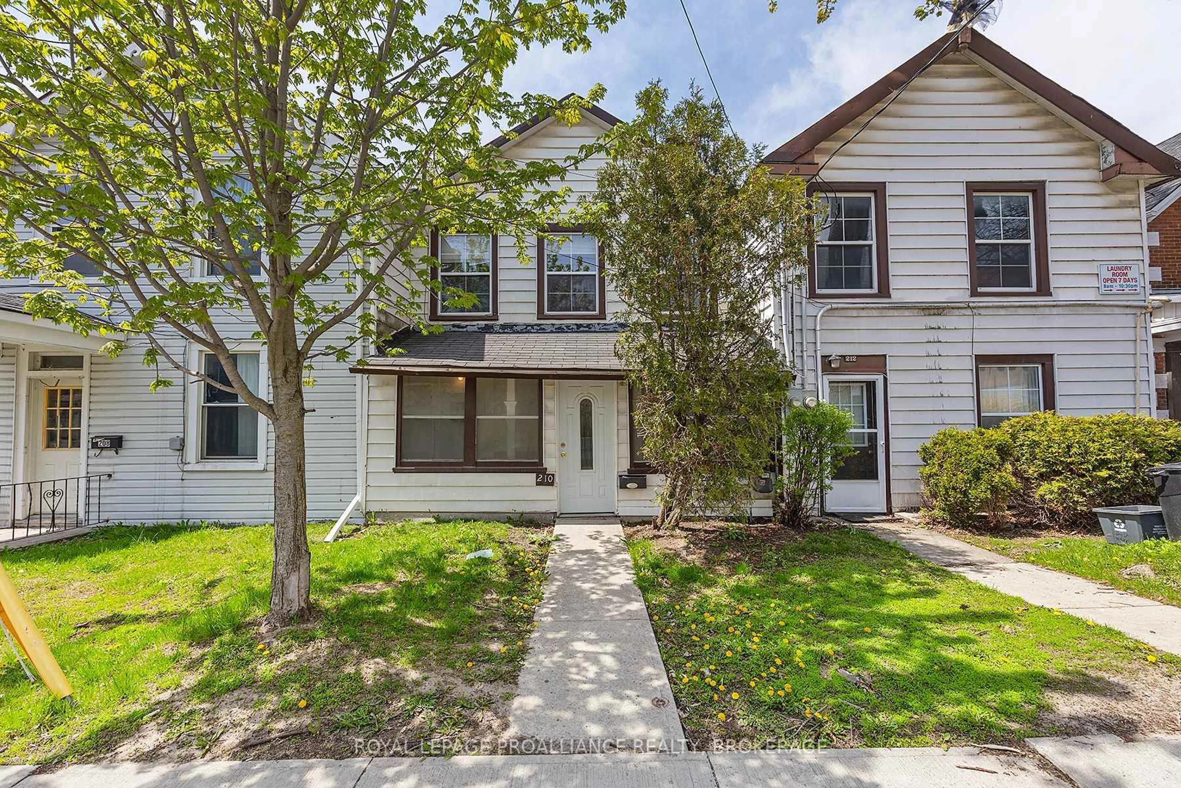 Home with vinyl exterior material, street for 210-212 University Ave, Kingston Ontario K7L 3P6