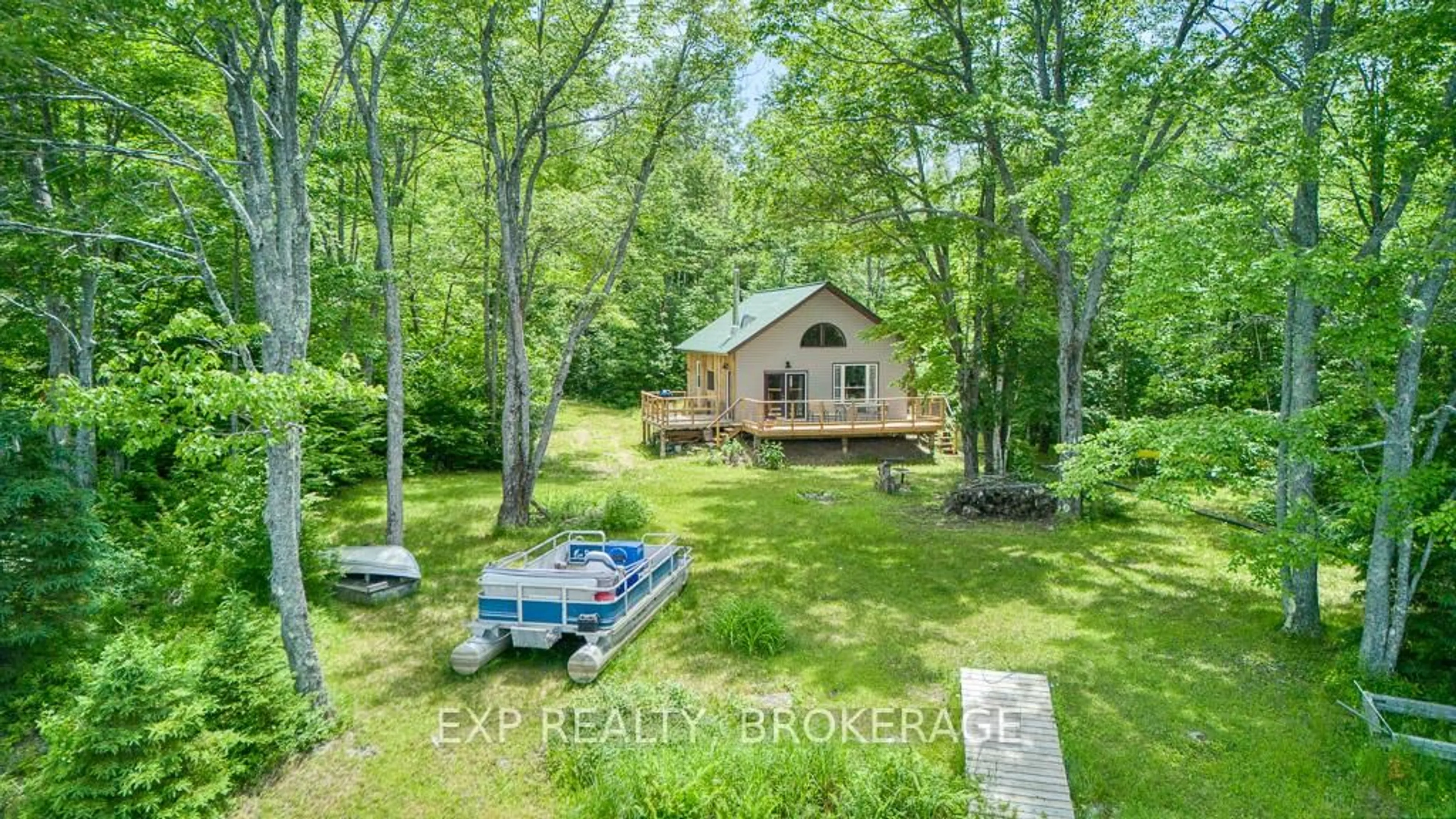 A pic from outside/outdoor area/front of a property/back of a property/a pic from drone, water/lake/river/ocean view for 1305 Thunder Lane, Arden Ontario K0H 1B0