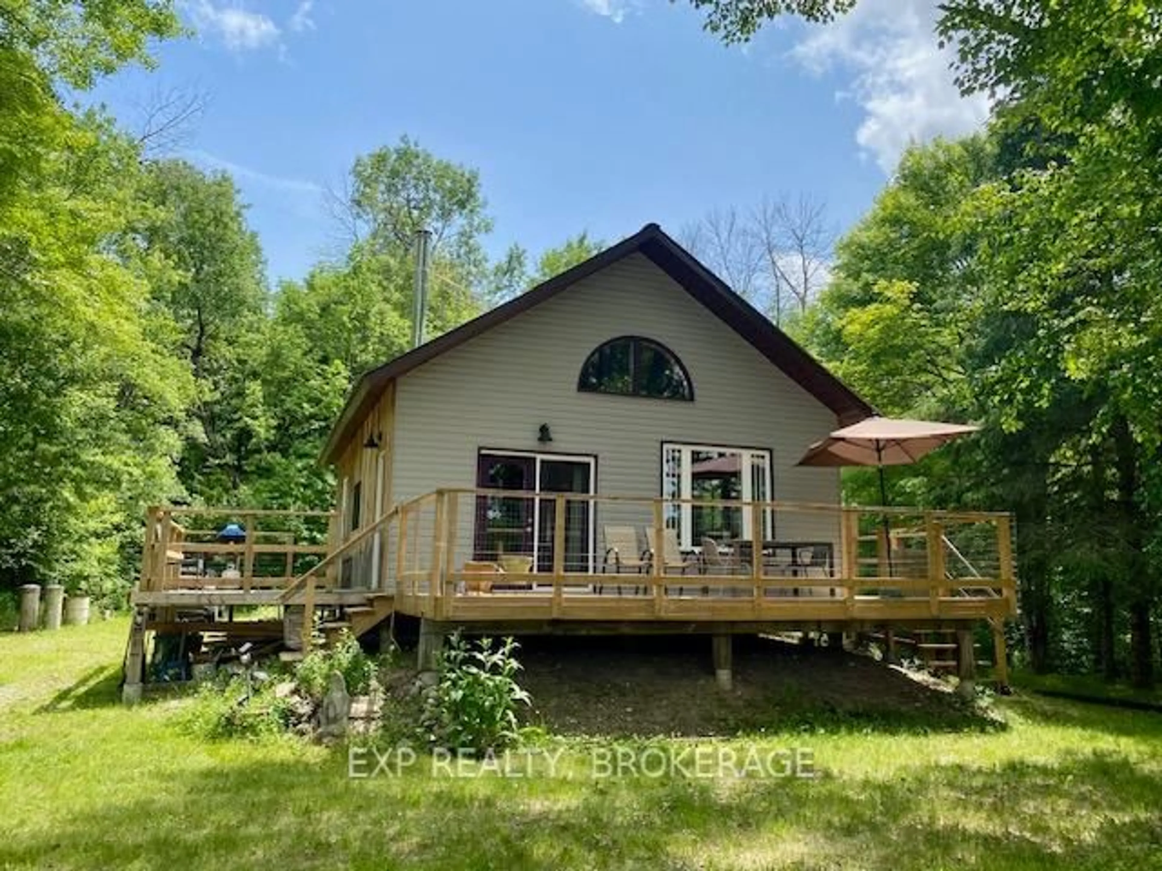 A pic from outside/outdoor area/front of a property/back of a property/a pic from drone, water/lake/river/ocean view for 1305 Thunder Lane, Arden Ontario K0H 1B0