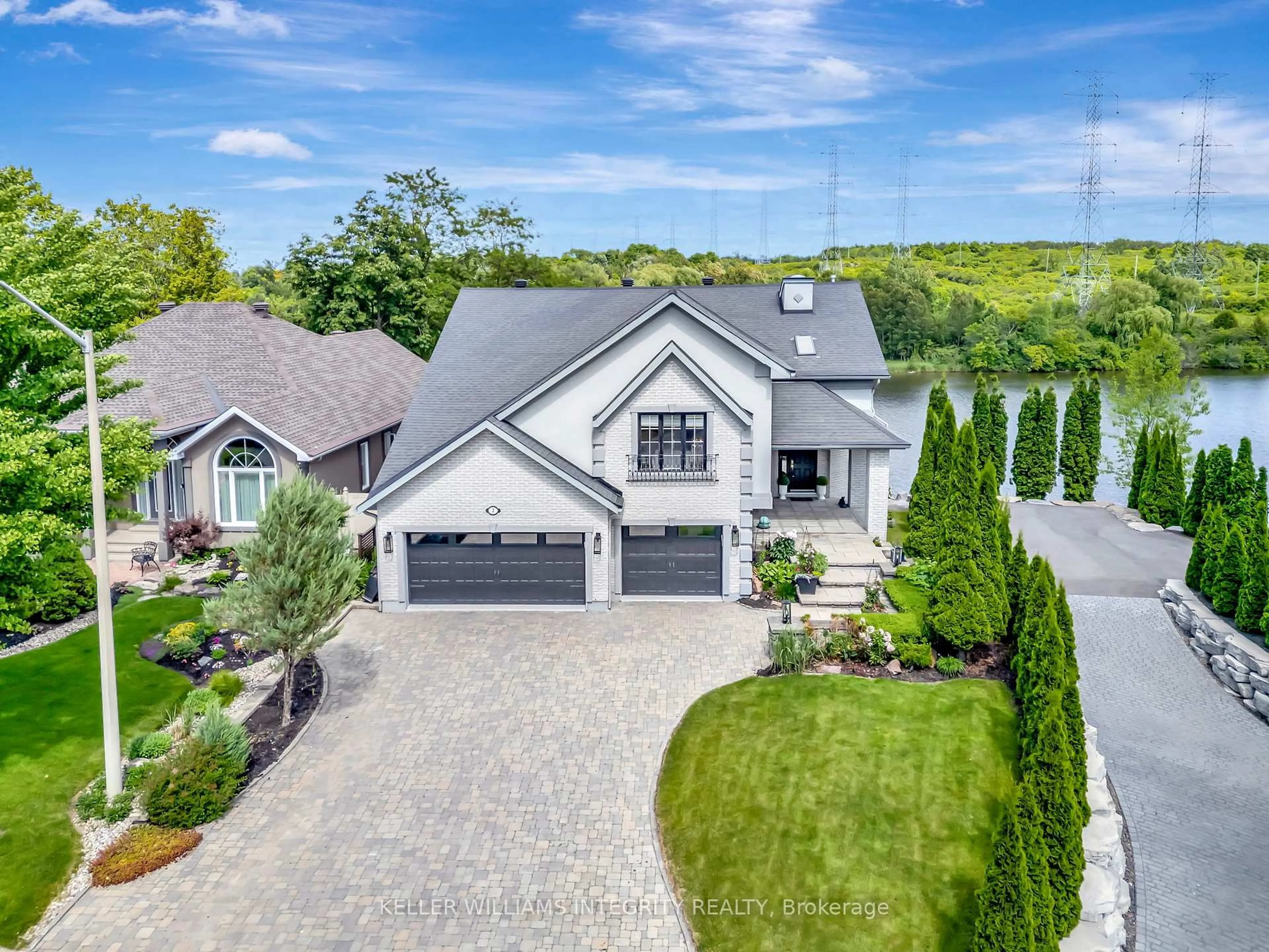 A pic from outside/outdoor area/front of a property/back of a property/a pic from drone, street for 2 Rideau Shore Crt, Ottawa Ontario K2C 3Y8