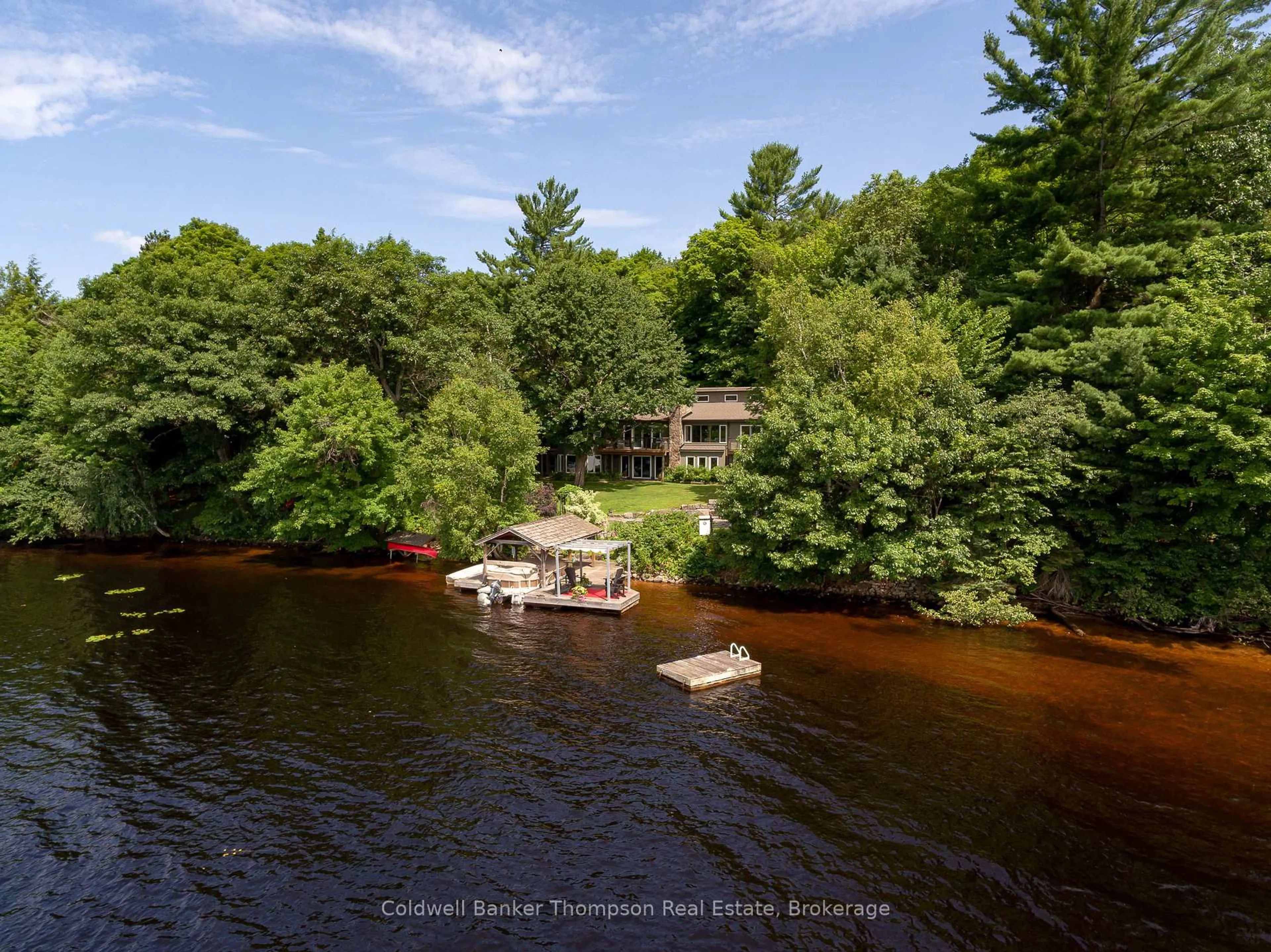 A pic from outside/outdoor area/front of a property/back of a property/a pic from drone, water/lake/river/ocean view for 54 Rowan Dr, Huntsville Ontario P1H 2J2
