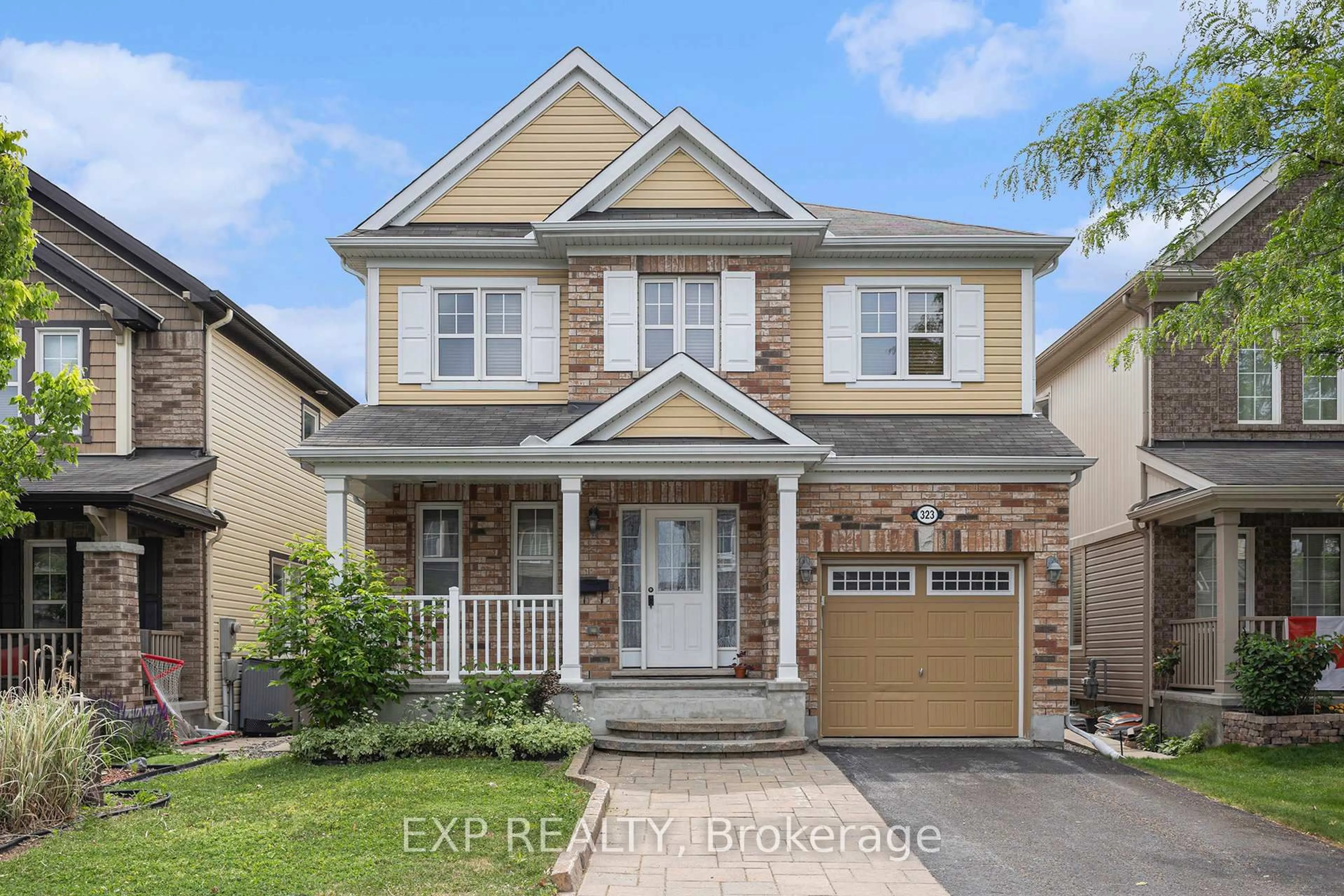 Home with brick exterior material, street for 323 Gallantry Way, Stittsville Ontario K2S 0P8