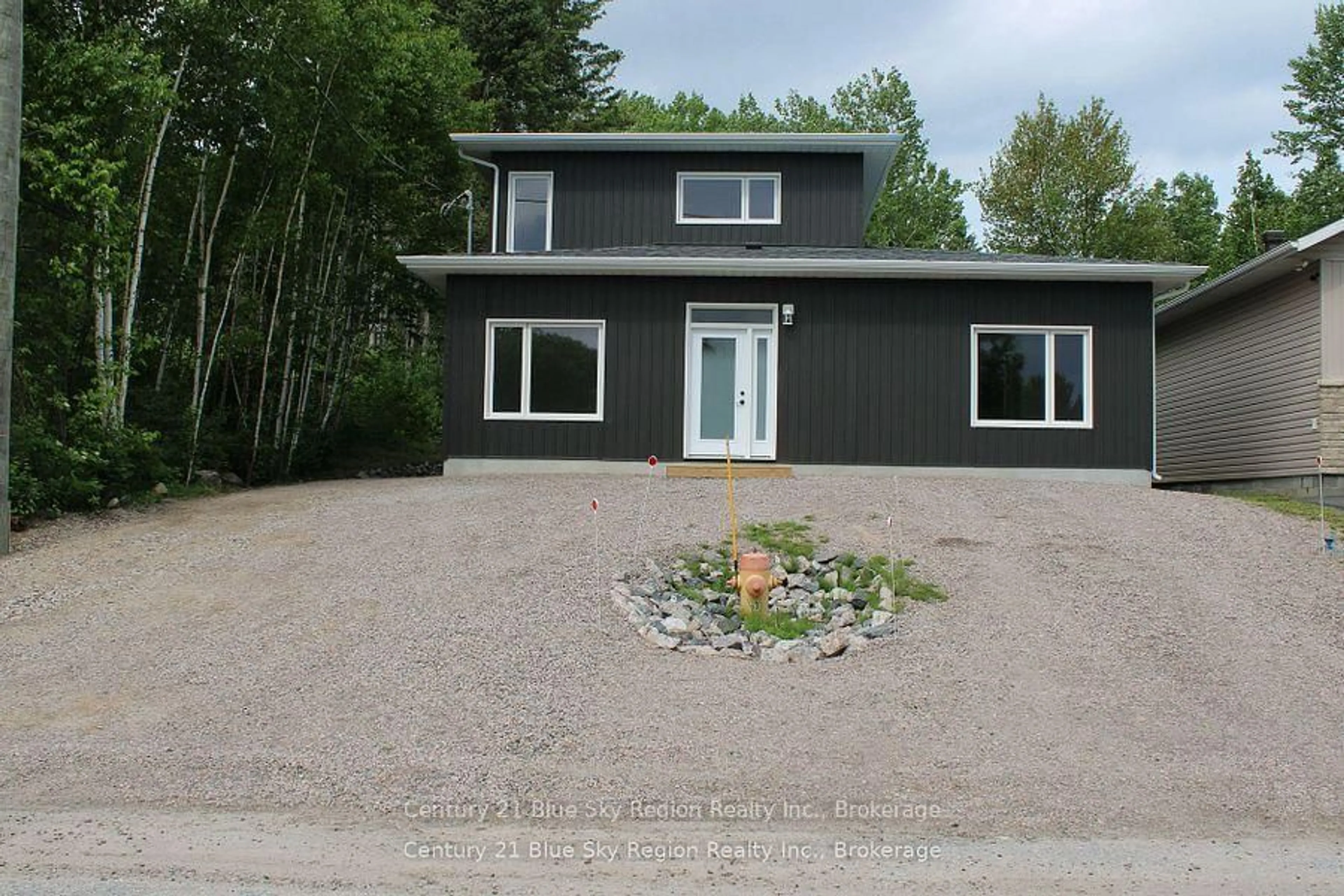 Home with vinyl exterior material, street for 16 Birch St, Powassan Ontario P0H 1Z0