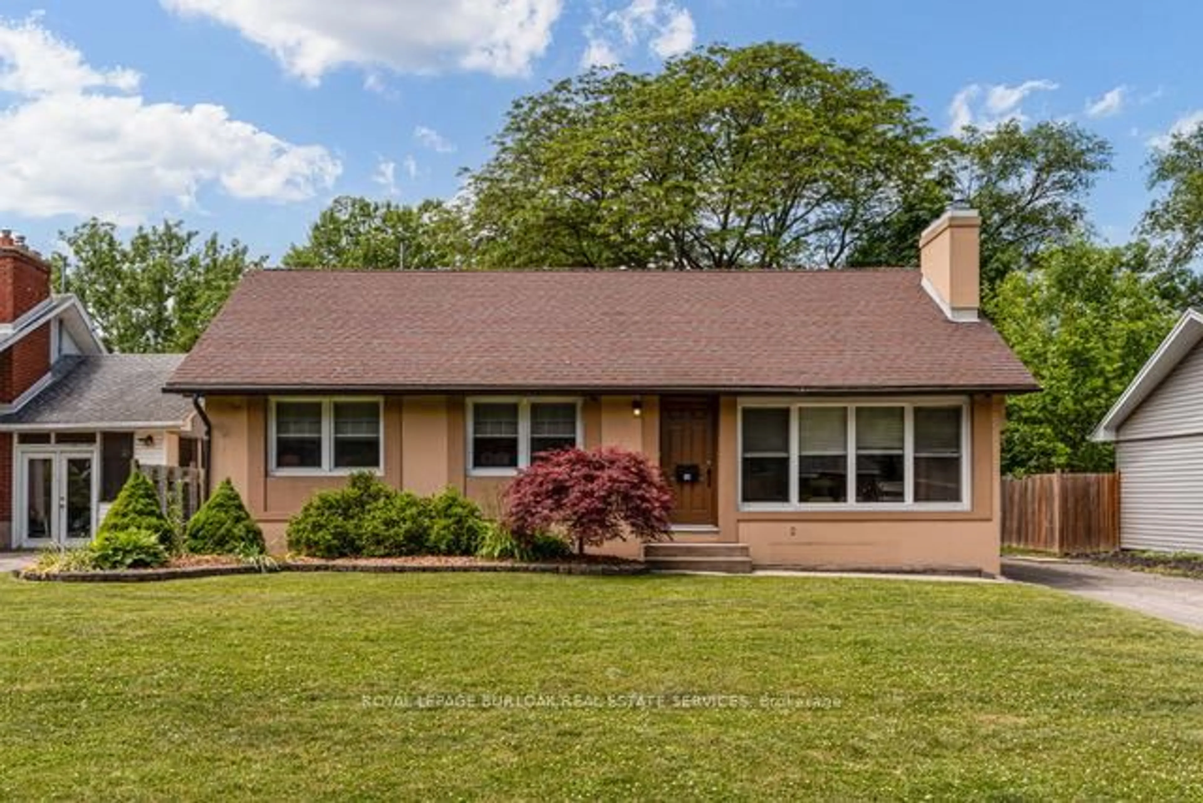 Home with vinyl exterior material, street for 14 Caroline St, St. Catharines Ontario L2T 3G1