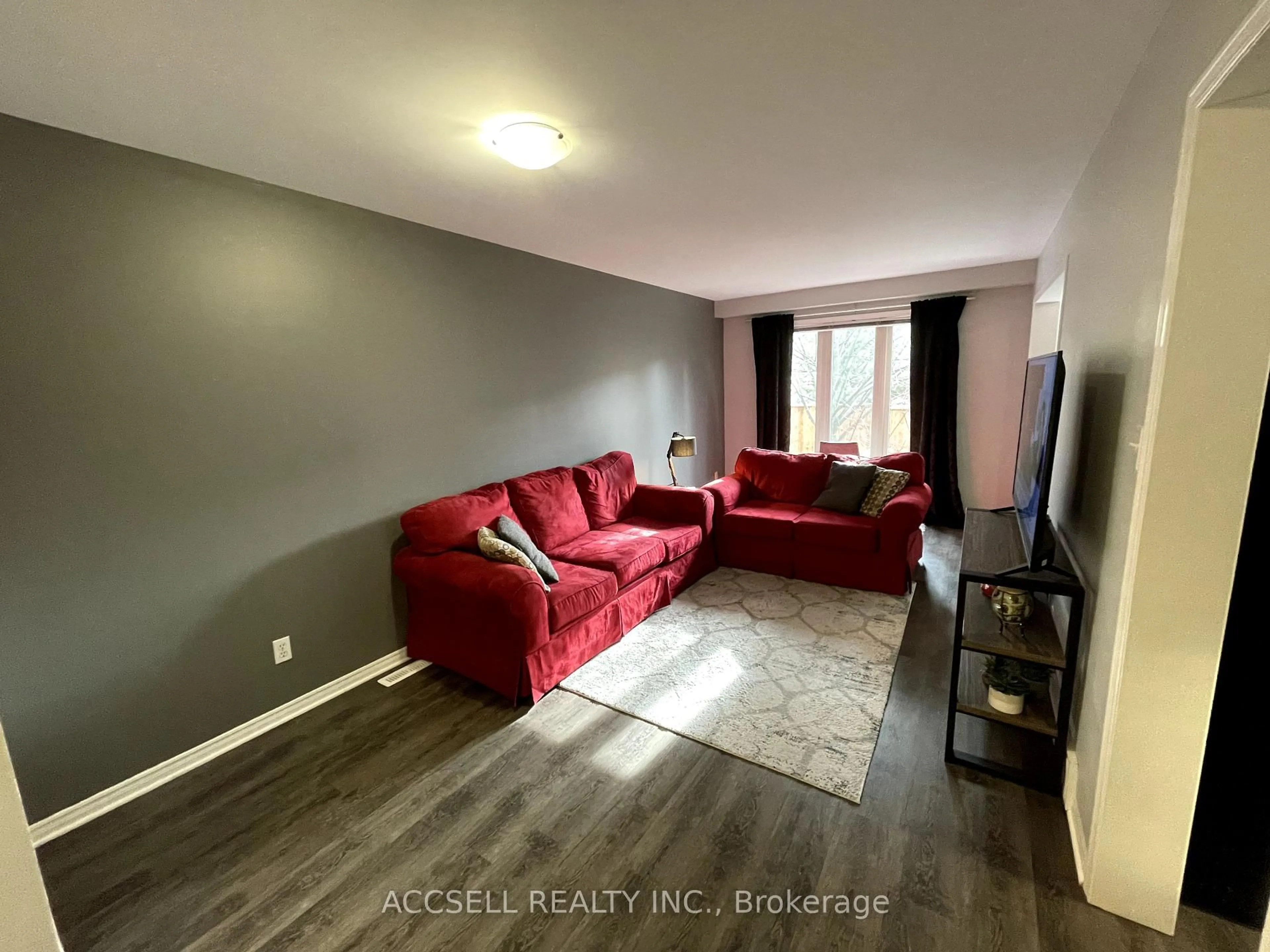 Living room with furniture, wood/laminate floor for 505 Proudfoot Lane #4, London North Ontario N6H 5N8