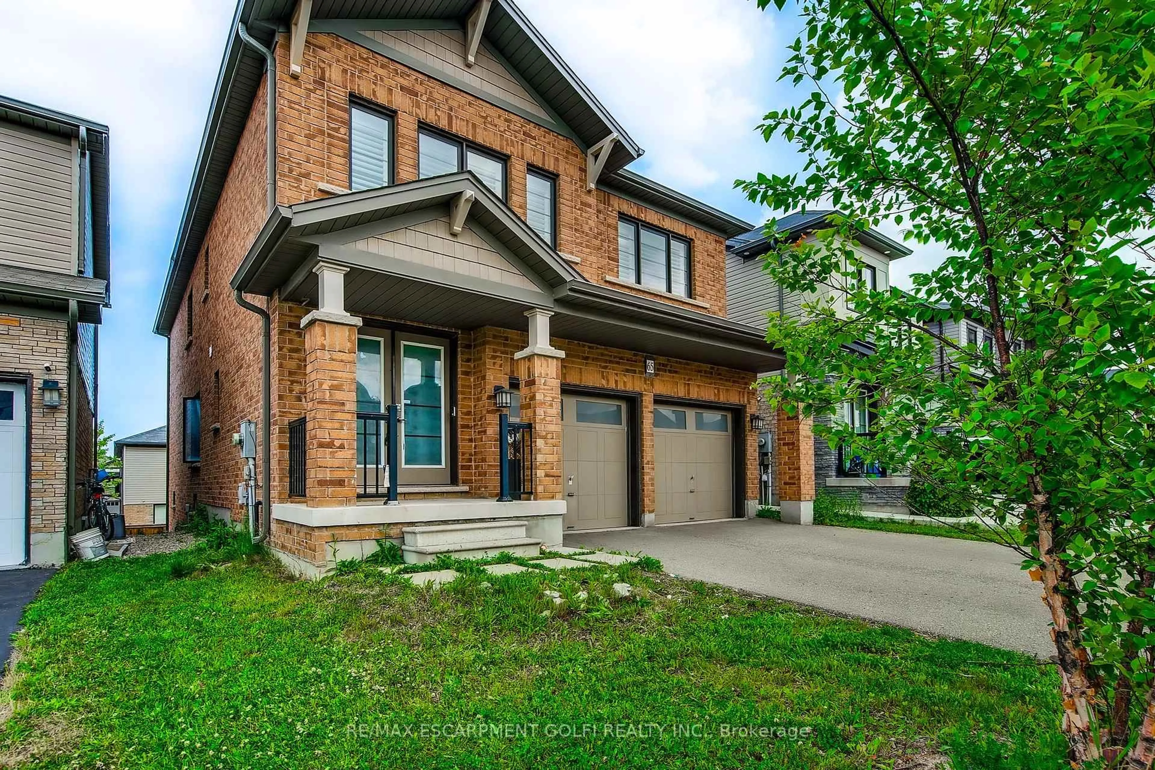 Home with brick exterior material, street for 65 West Glen Ave, Hamilton Ontario L8J 2V5