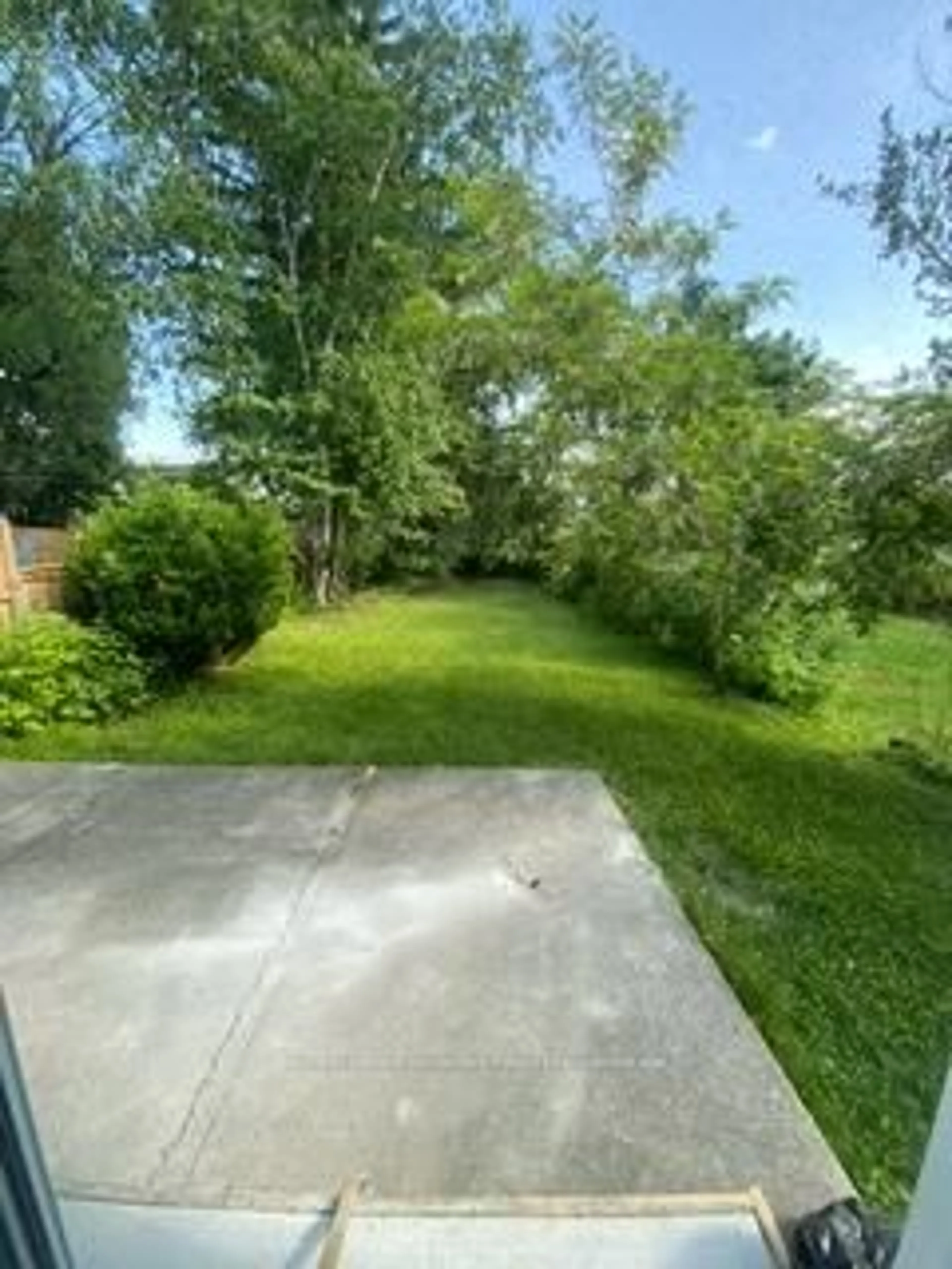 A pic from outside/outdoor area/front of a property/back of a property/a pic from drone, forest/trees view for 24 Springbrook Dr #A, Peterborough West Ontario K9J 1L1
