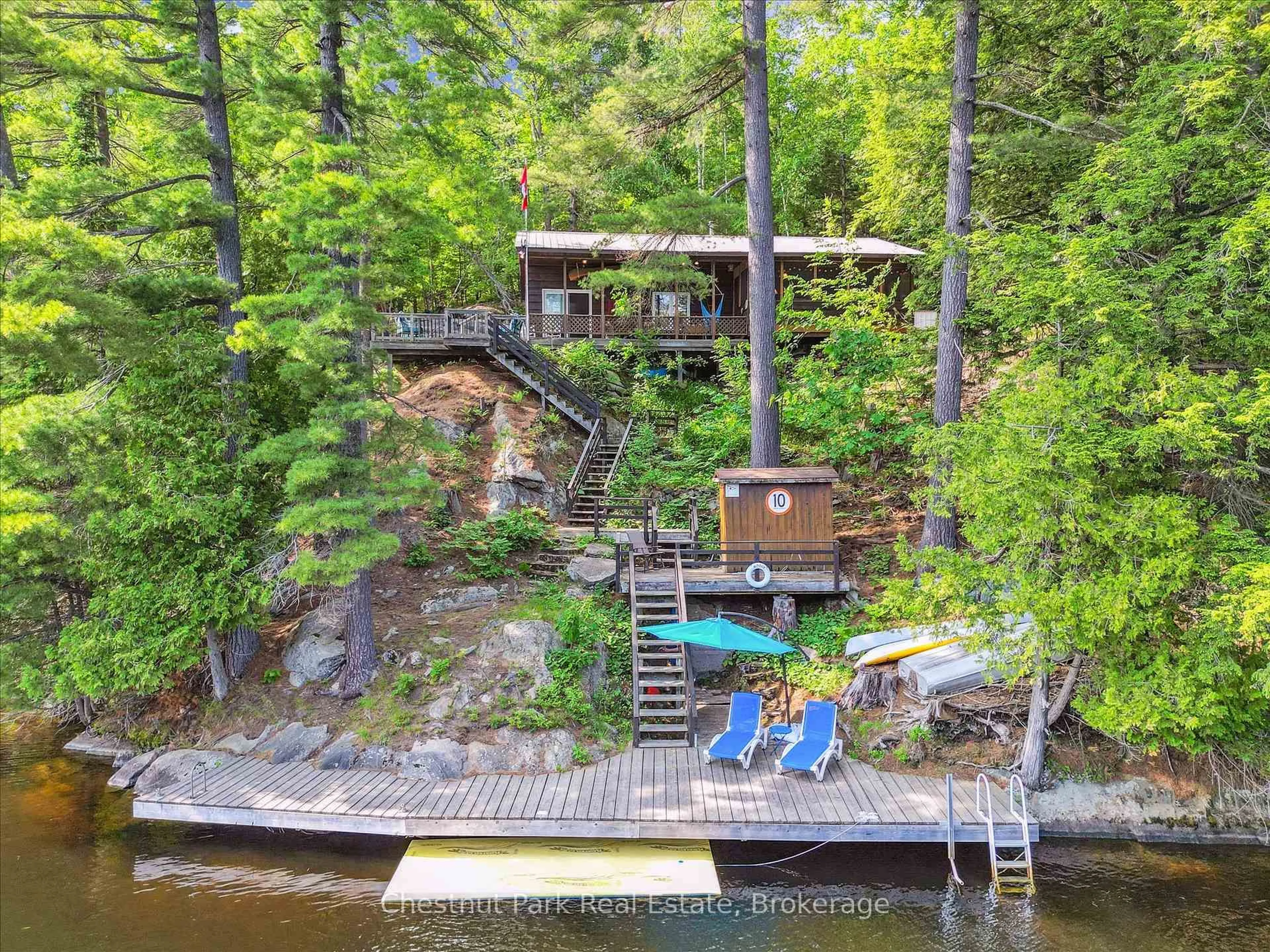 A pic from outside/outdoor area/front of a property/back of a property/a pic from drone, water/lake/river/ocean view for 1082 Maplewood Rd, Bracebridge Ontario P1L 1W8