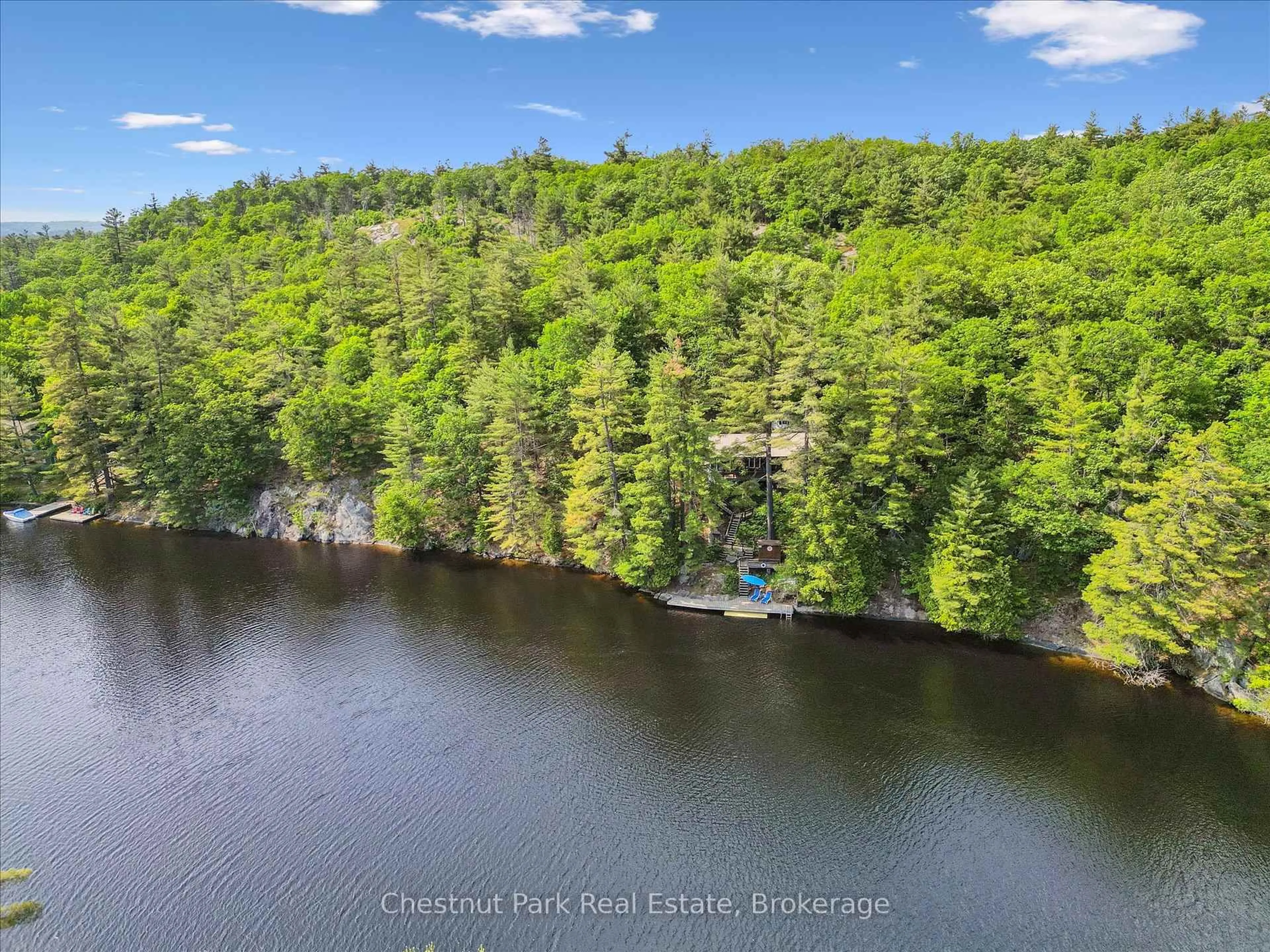 A pic from outside/outdoor area/front of a property/back of a property/a pic from drone, water/lake/river/ocean view for 1082 Maplewood Rd, Bracebridge Ontario P1L 1W8