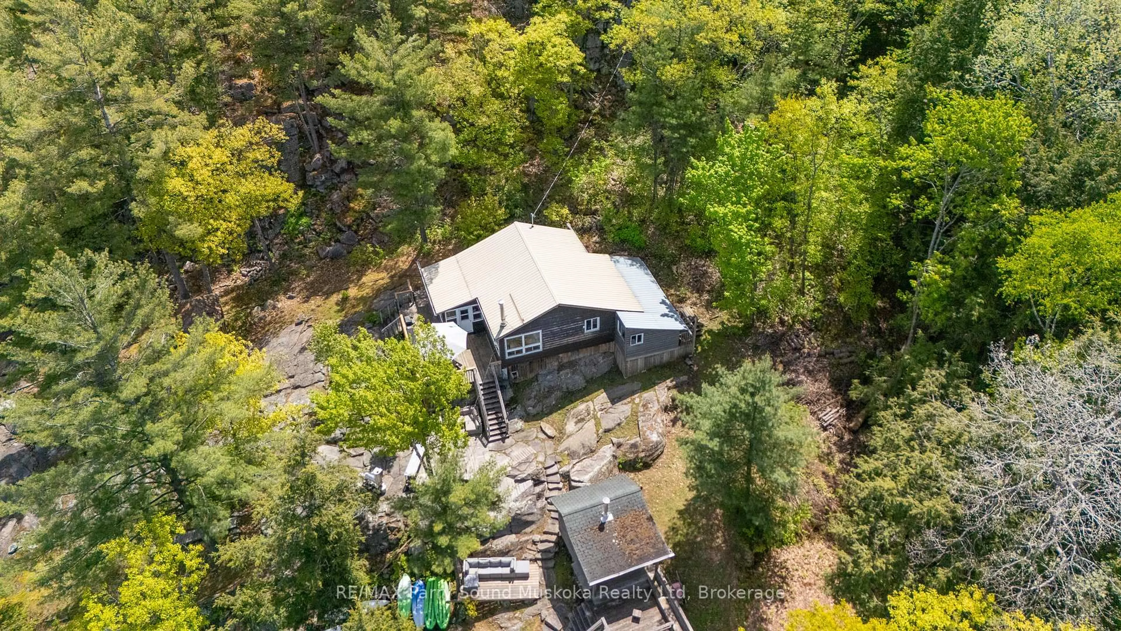 A pic from outside/outdoor area/front of a property/back of a property/a pic from drone, forest/trees view for 7 Isabella Island, The Archipelago Ontario P2A 2W8