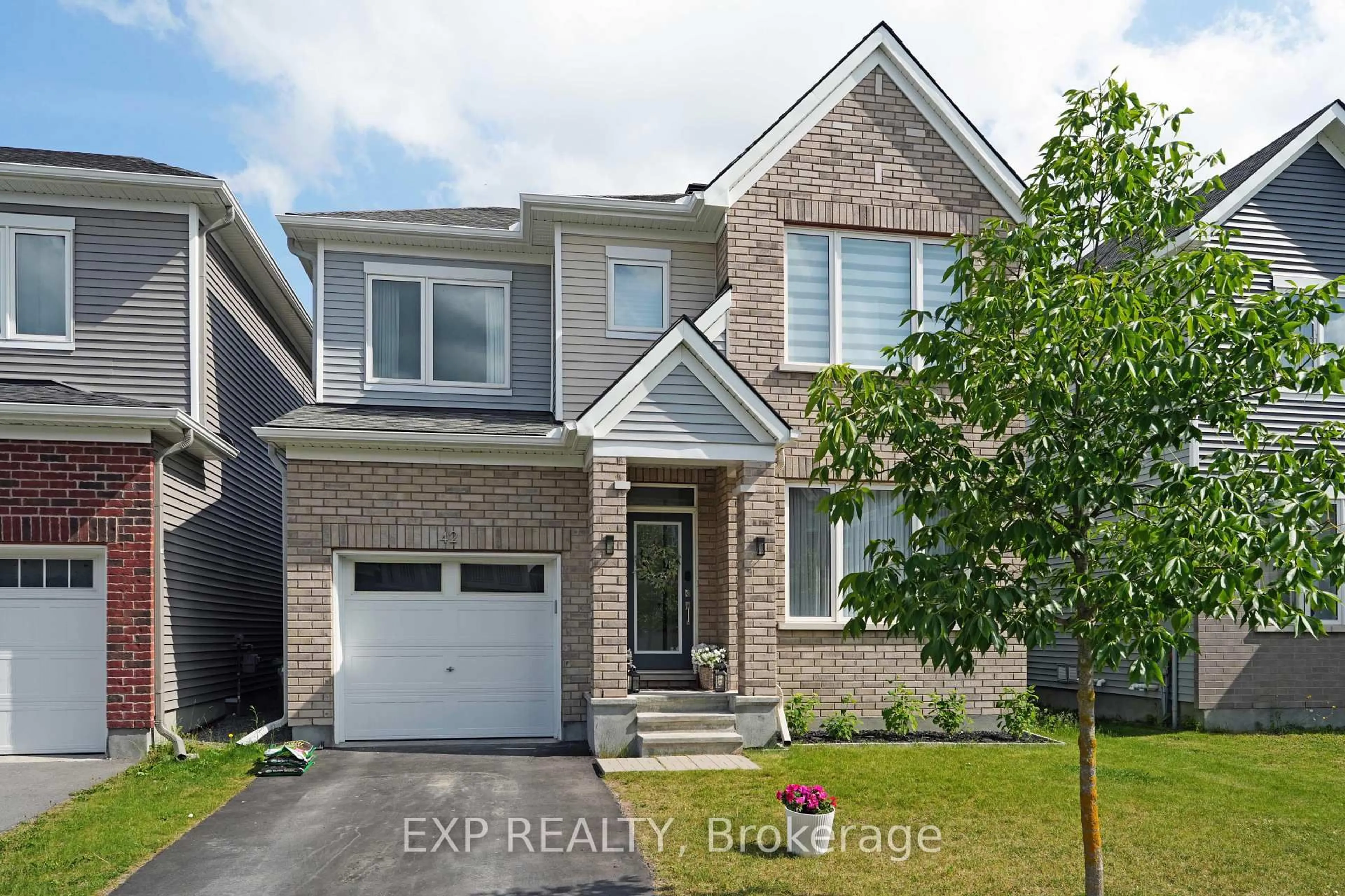 Home with brick exterior material, street for 42 Montology Way, Ottawa Ontario K2J 7A4