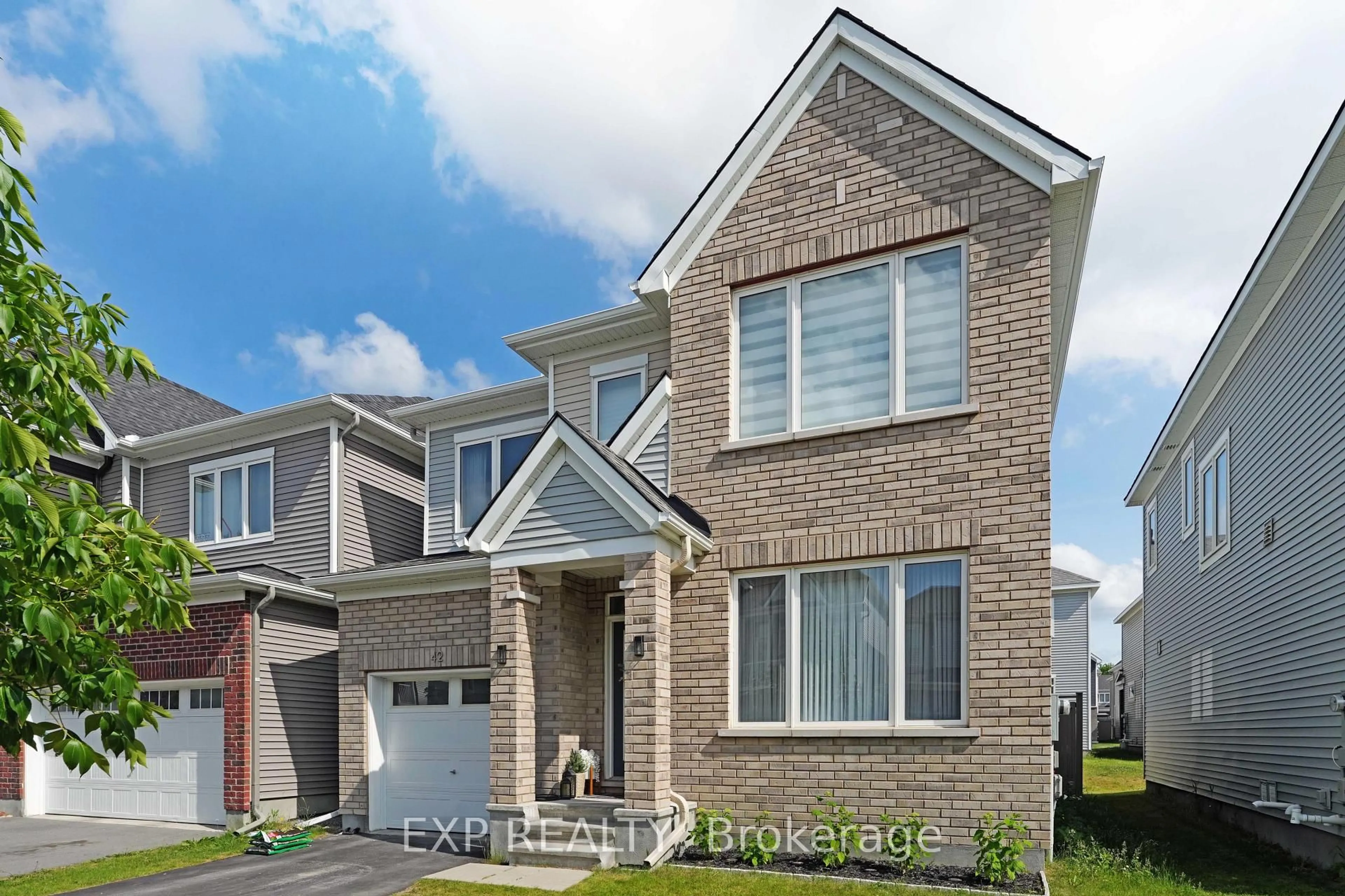 Home with brick exterior material, street for 42 Montology Way, Ottawa Ontario K2J 7A4