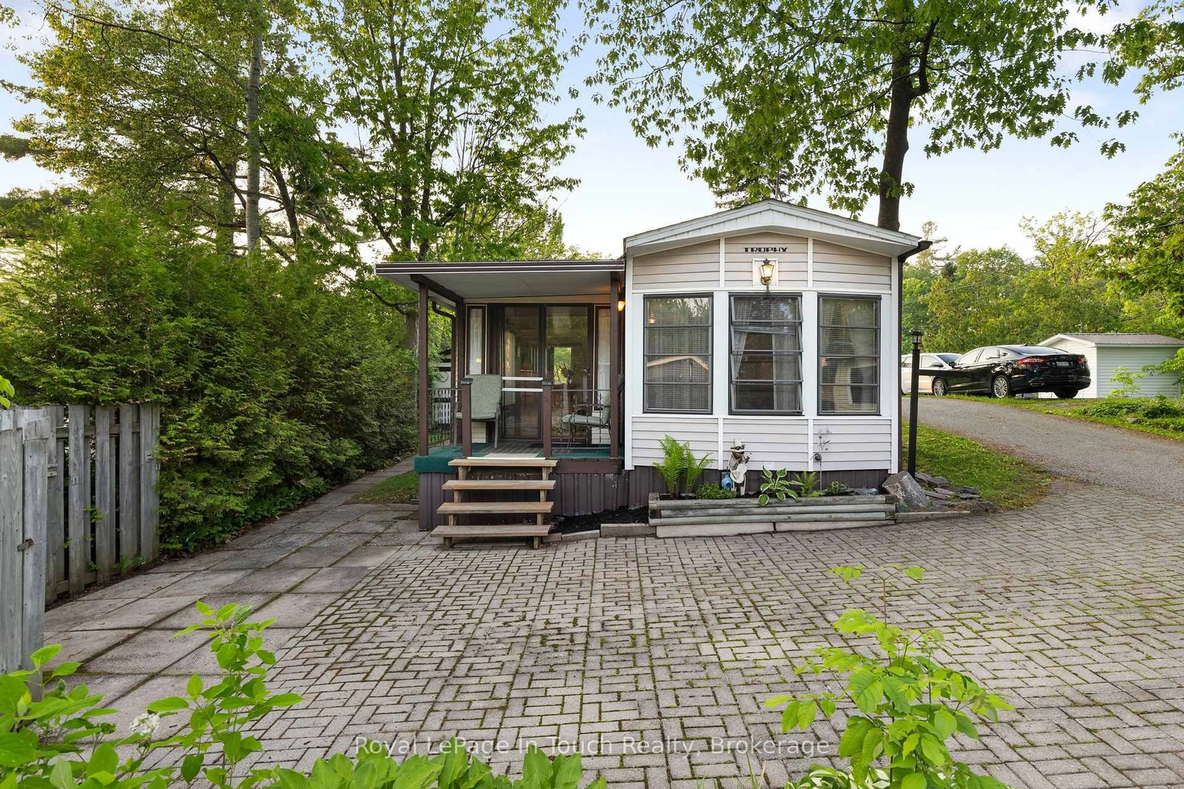 Home with vinyl exterior material, street for 164 Lone Pine Rd ##130, Georgian Bay Ontario L0K 1S0