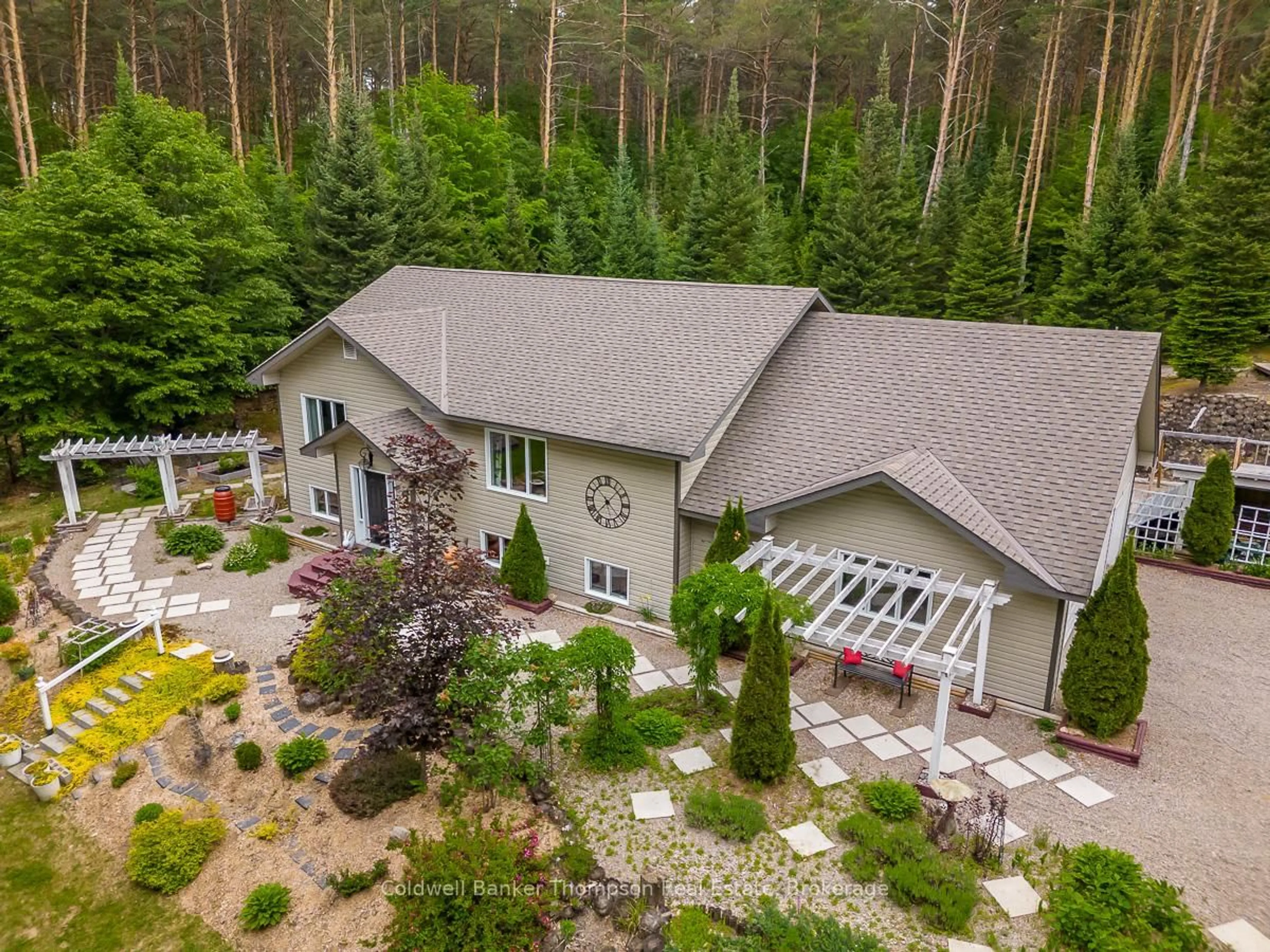 A pic from outside/outdoor area/front of a property/back of a property/a pic from drone, forest/trees view for 229 So Ho Mish Rd, Perry Ontario P0A 1J0