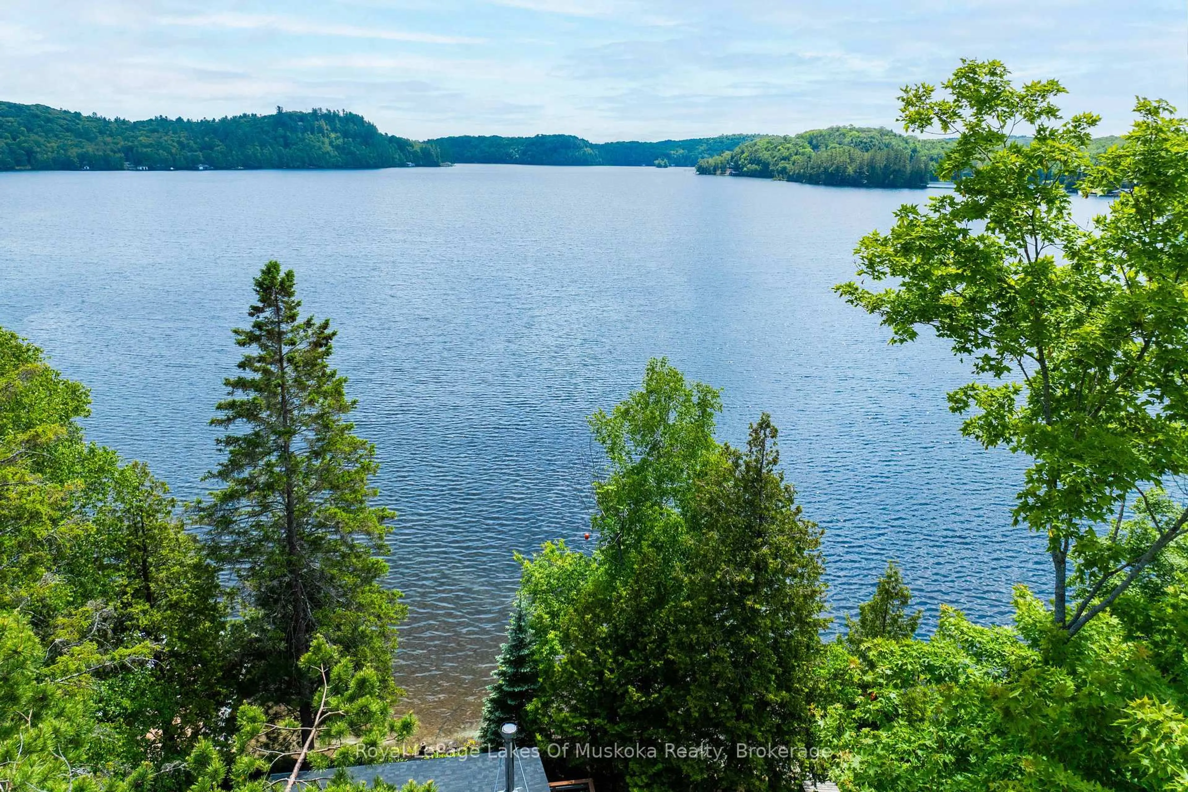 A pic from outside/outdoor area/front of a property/back of a property/a pic from drone, water/lake/river/ocean view for 1405 South Portage Rd, Lake of Bays Ontario P0A 1H0