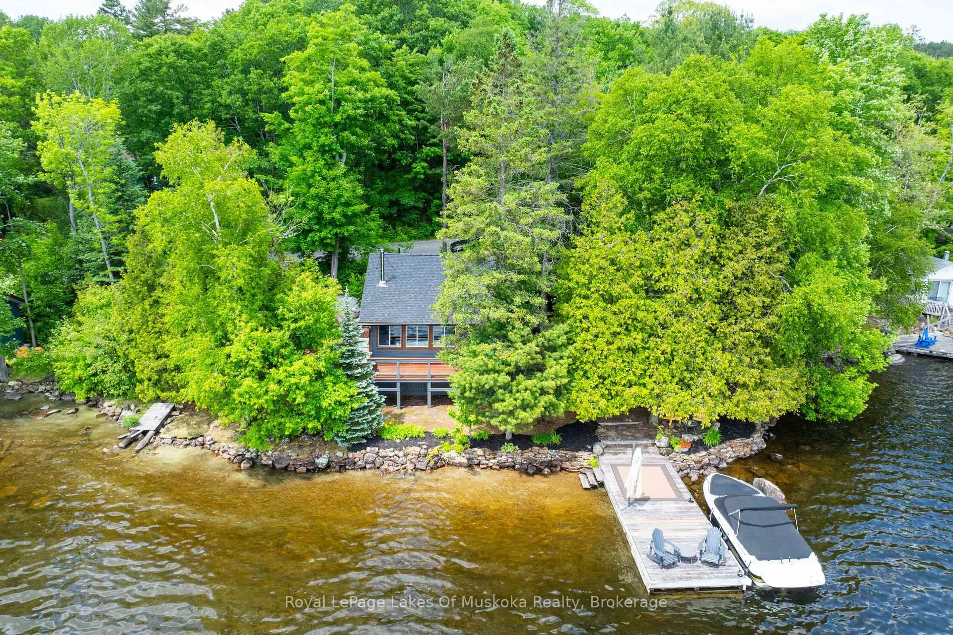 A pic from outside/outdoor area/front of a property/back of a property/a pic from drone, water/lake/river/ocean view for 1405 South Portage Rd, Lake of Bays Ontario P0A 1H0