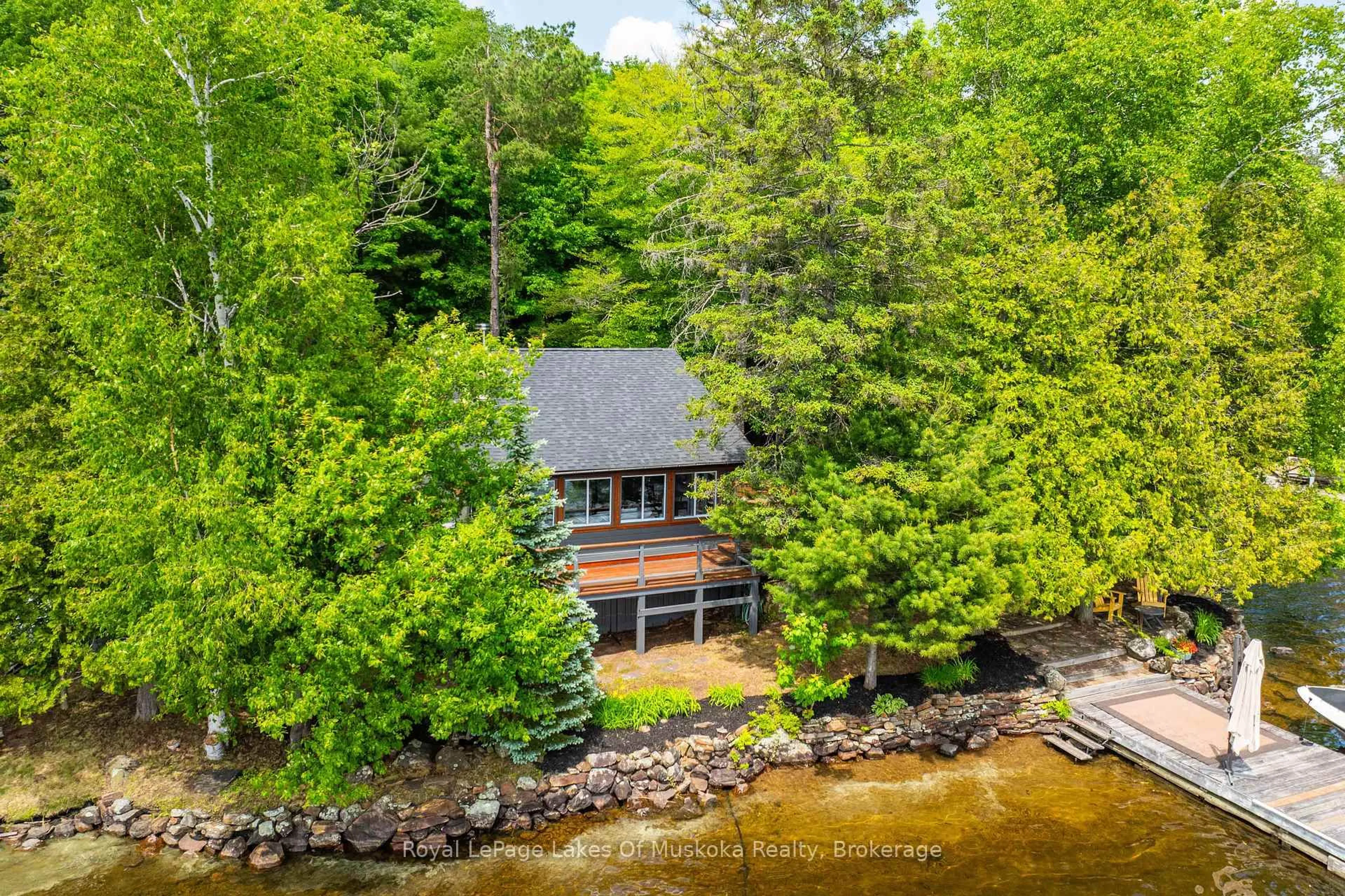 A pic from outside/outdoor area/front of a property/back of a property/a pic from drone, water/lake/river/ocean view for 1405 South Portage Rd, Lake of Bays Ontario P0A 1H0
