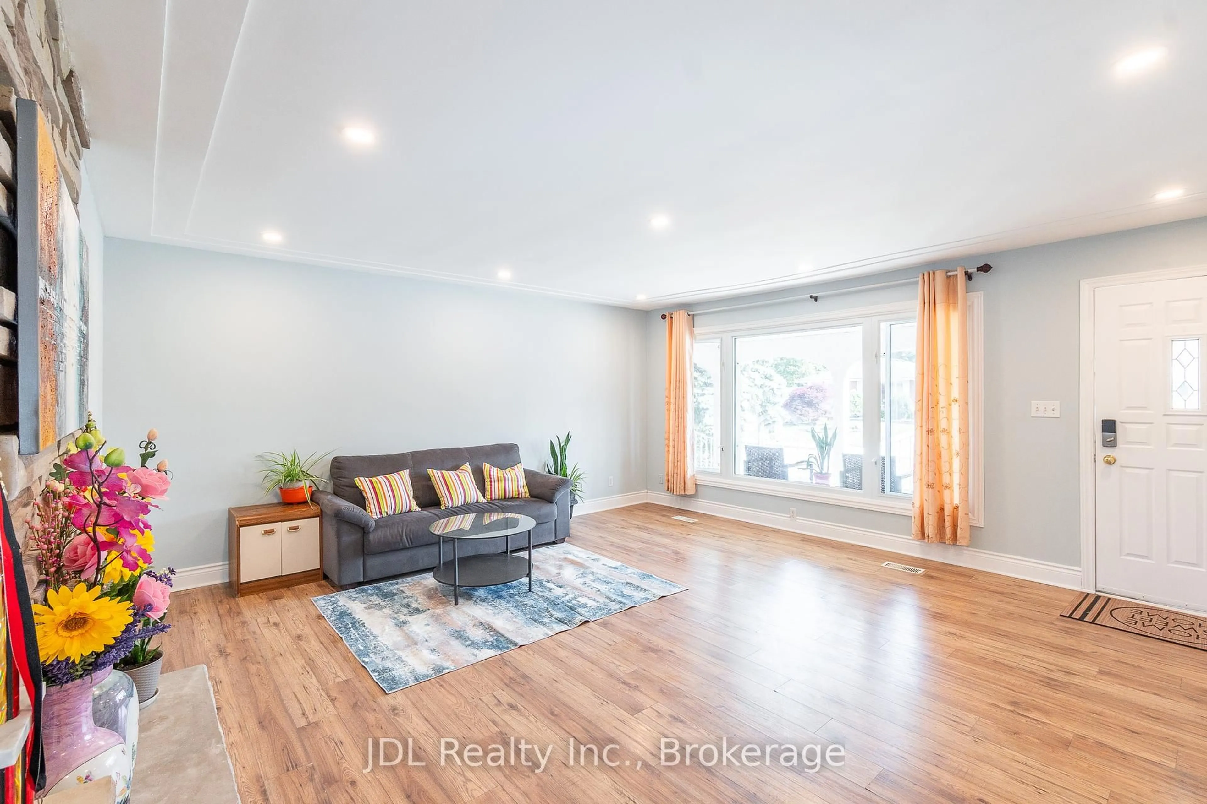 Living room with furniture, wood/laminate floor for 121 Delmar Dr, Hamilton Ontario L9C 1J8