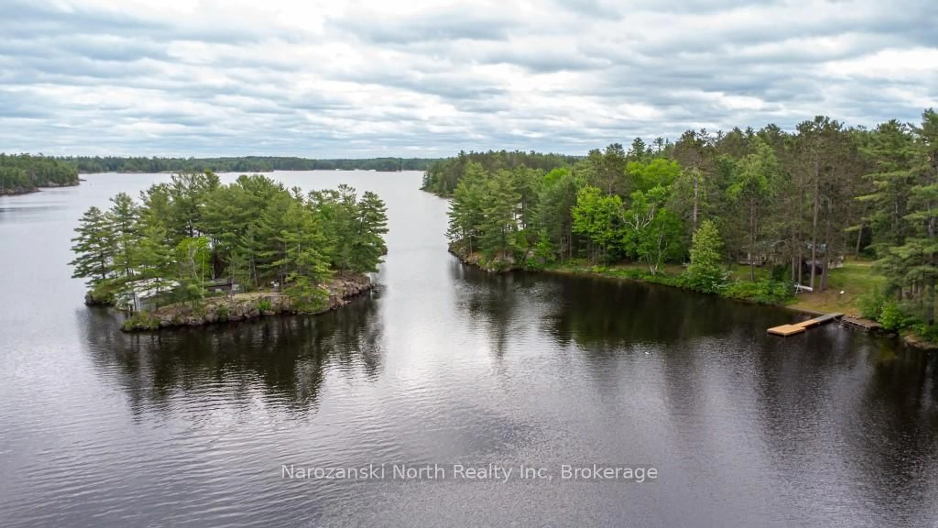 A pic from outside/outdoor area/front of a property/back of a property/a pic from drone, water/lake/river/ocean view for 8162 Hwy 64, French River Ontario P0M 2K0
