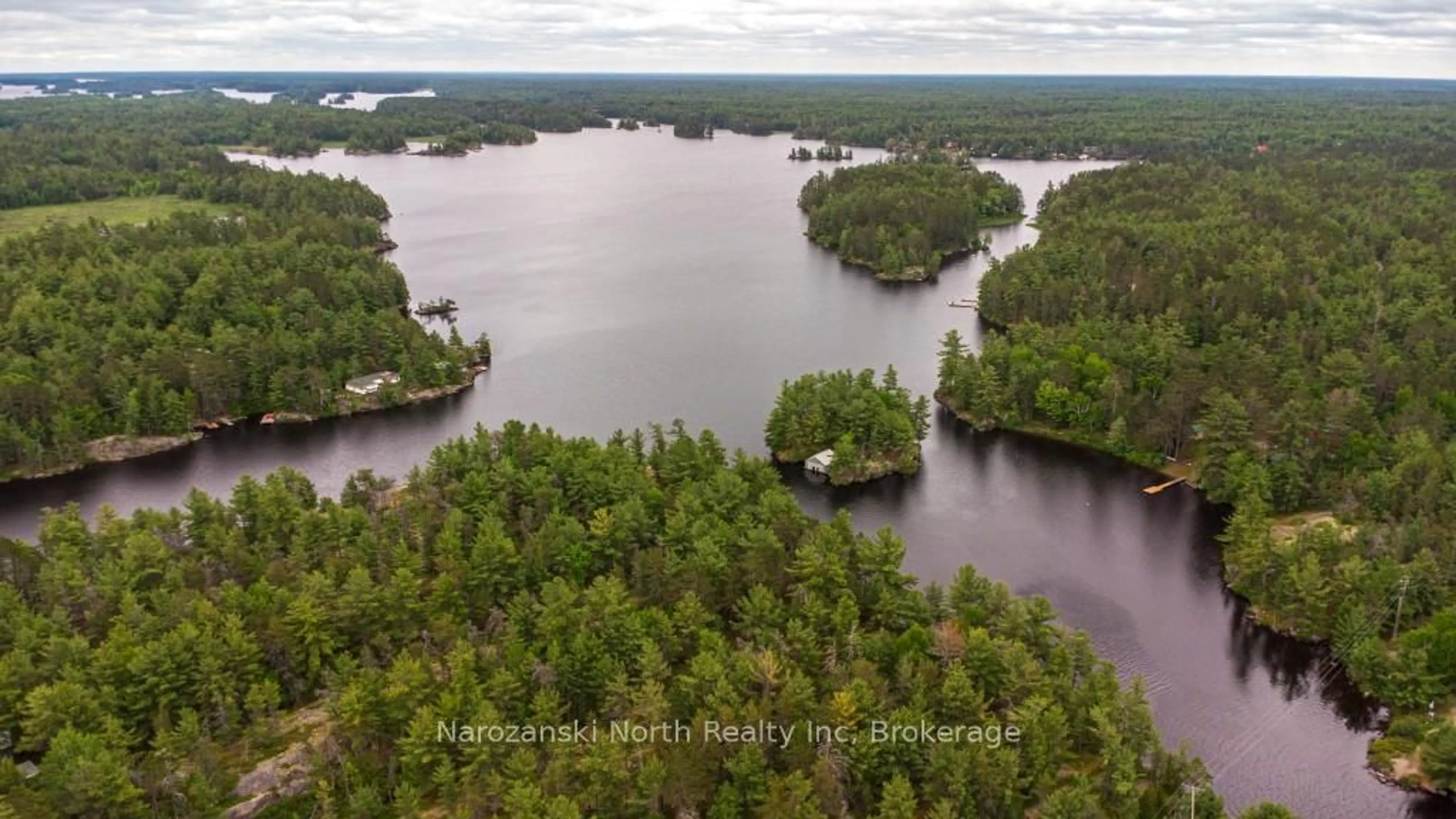 A pic from outside/outdoor area/front of a property/back of a property/a pic from drone, water/lake/river/ocean view for 8162 Hwy 64, French River Ontario P0M 2K0