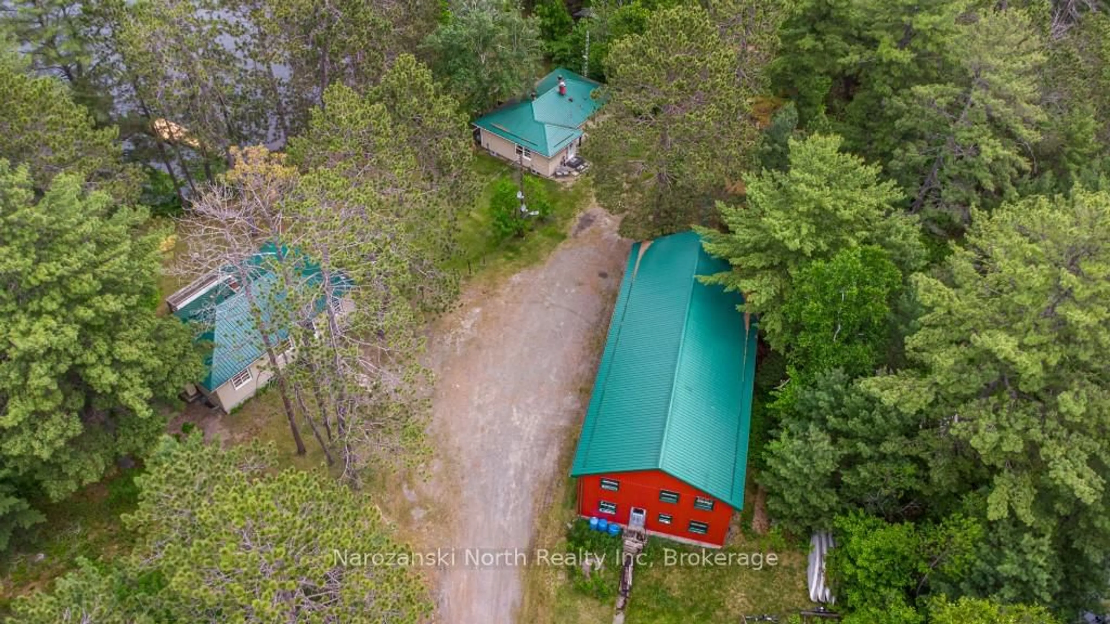 A pic from outside/outdoor area/front of a property/back of a property/a pic from drone, forest/trees view for 8162 Hwy 64, French River Ontario P0M 2K0