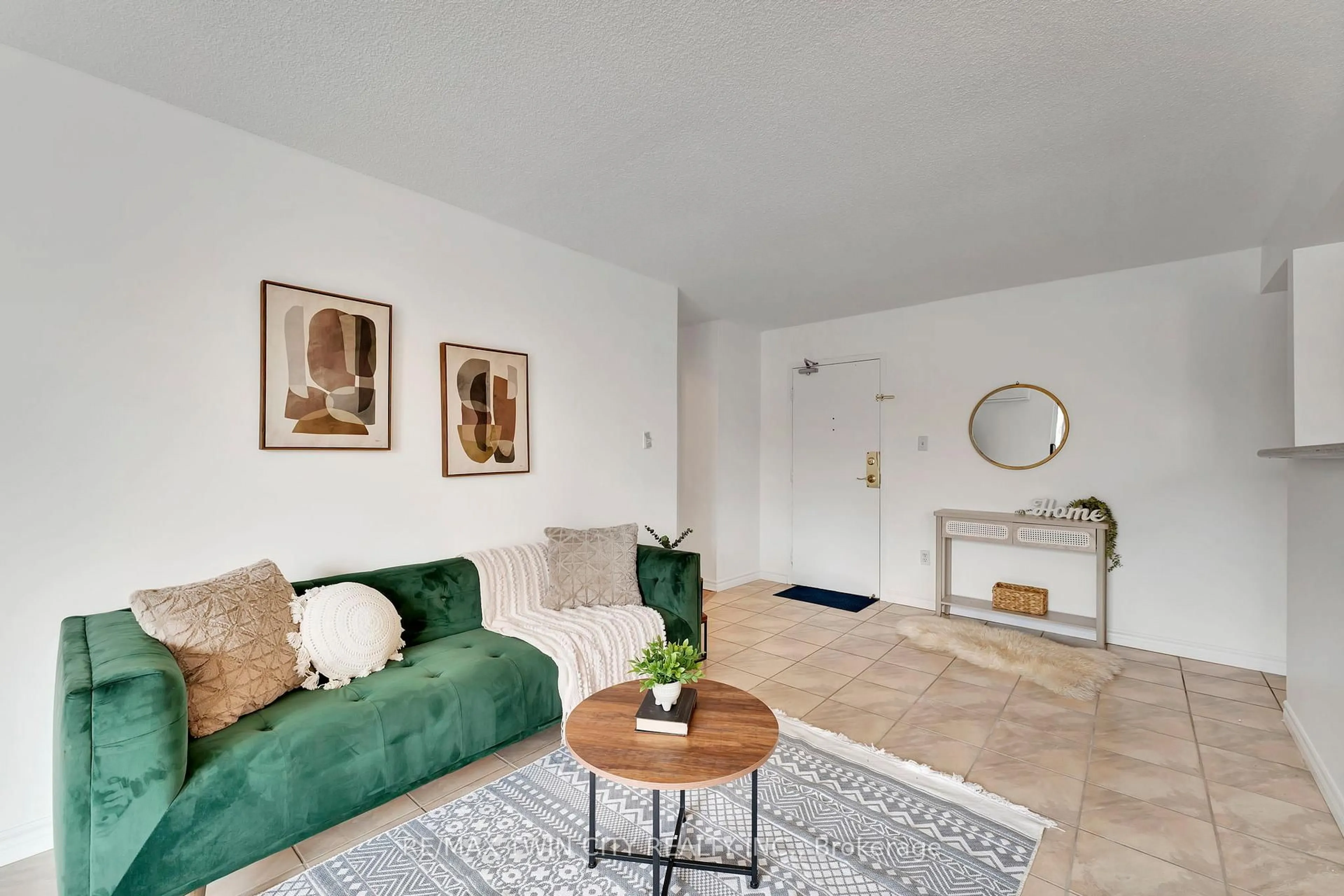 Living room with furniture, unknown for 793 Colborne St #207, Brantford Ontario N3S 7J3