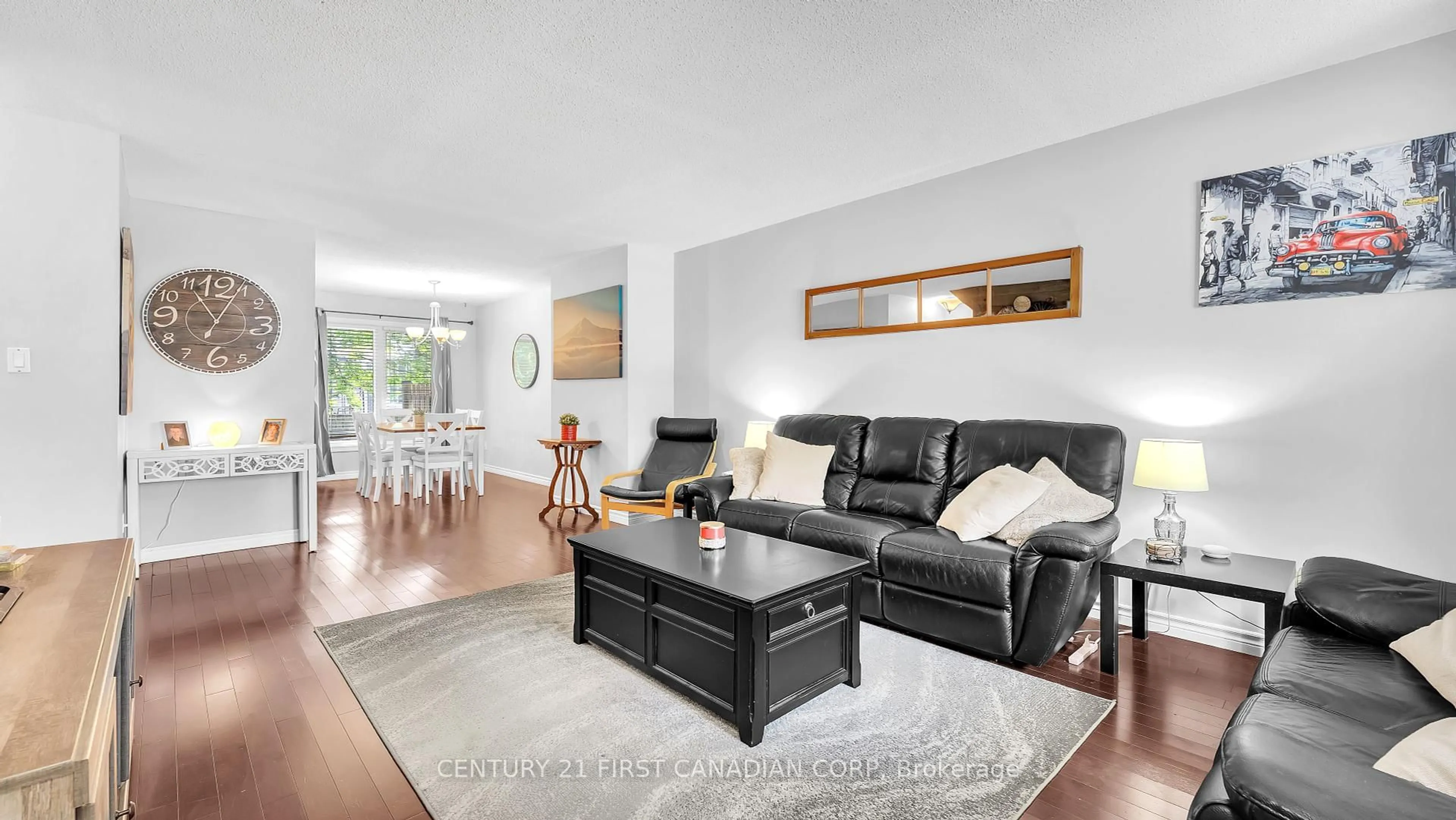 Living room with furniture, wood/laminate floor for 1138 Kipps Lane #4, London East Ontario N5Y 5K6