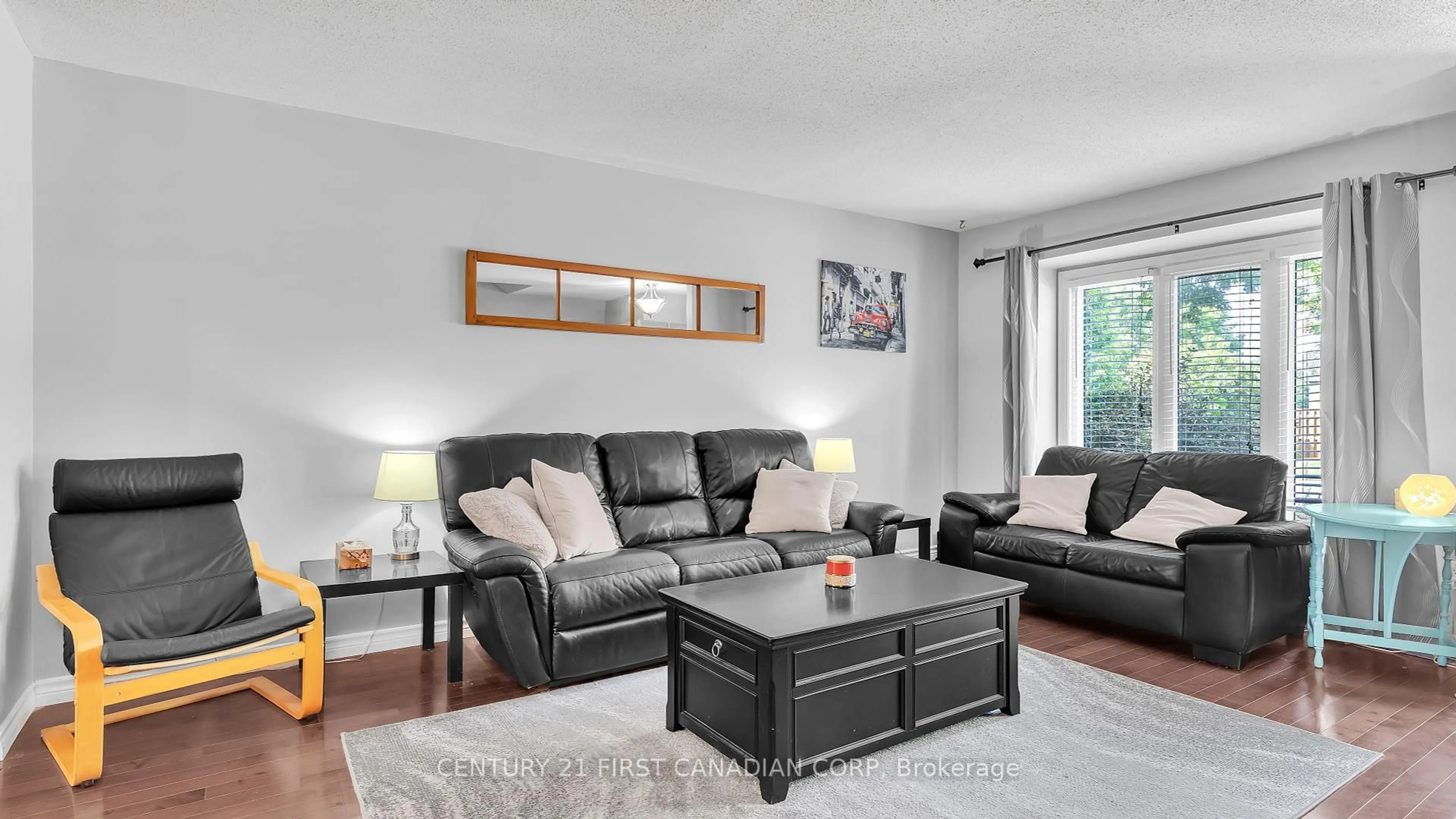 Living room with furniture, wood/laminate floor for 1138 Kipps Lane #4, London East Ontario N5Y 5K6
