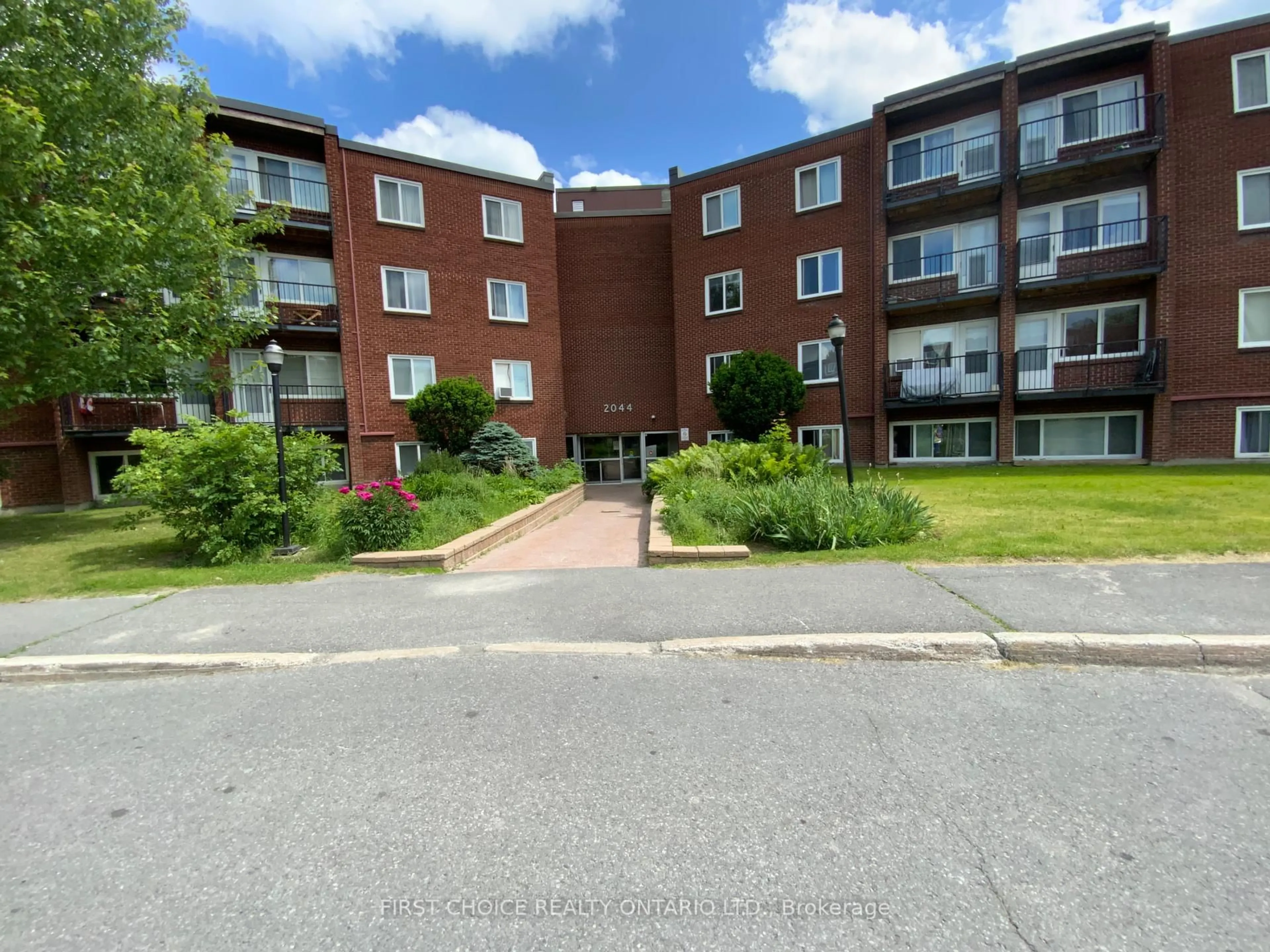 A pic from outside/outdoor area/front of a property/back of a property/a pic from drone, street for 2044 Arrowsmith Dr #408C, Ottawa Ontario K1J 7V8