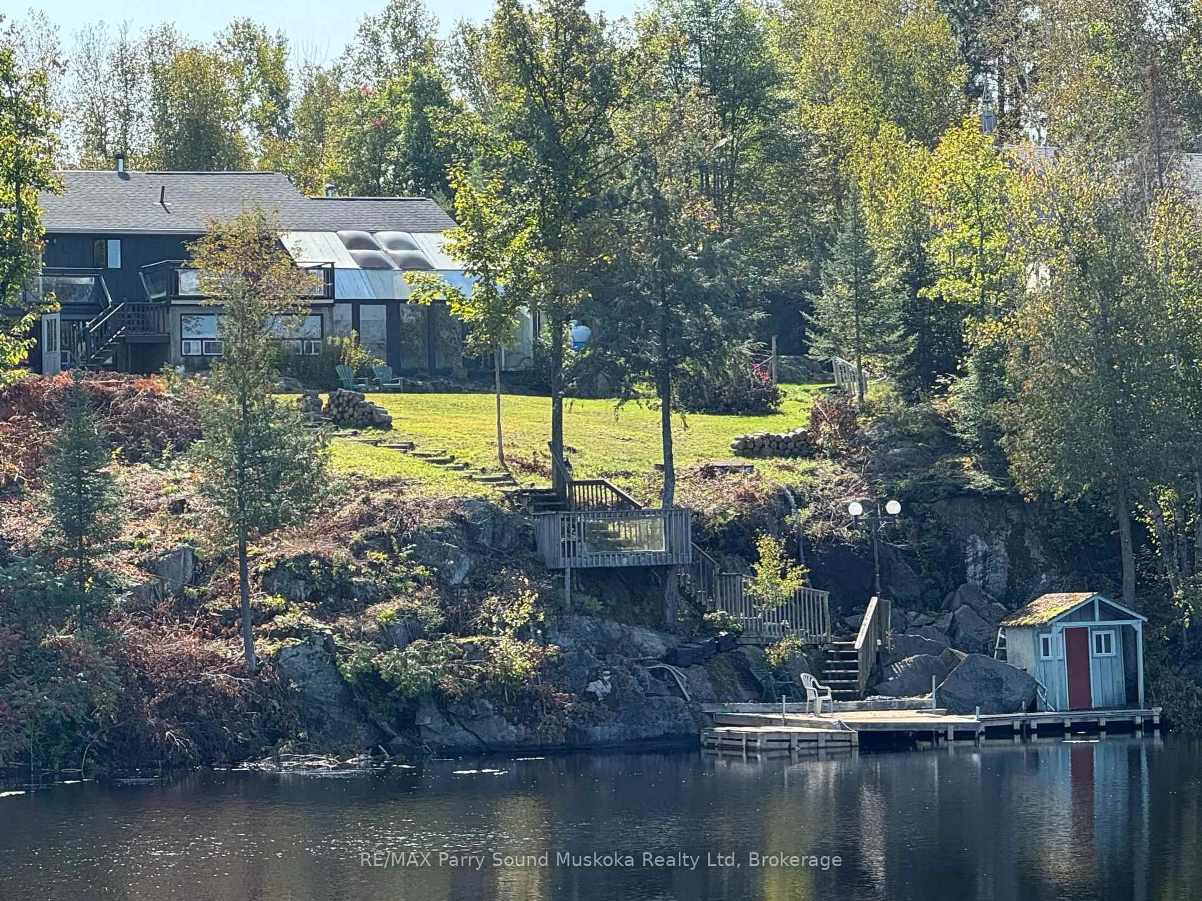 A pic from outside/outdoor area/front of a property/back of a property/a pic from drone, water/lake/river/ocean view for 1 GENE'S Crt, McKellar Ontario P2A 0B4
